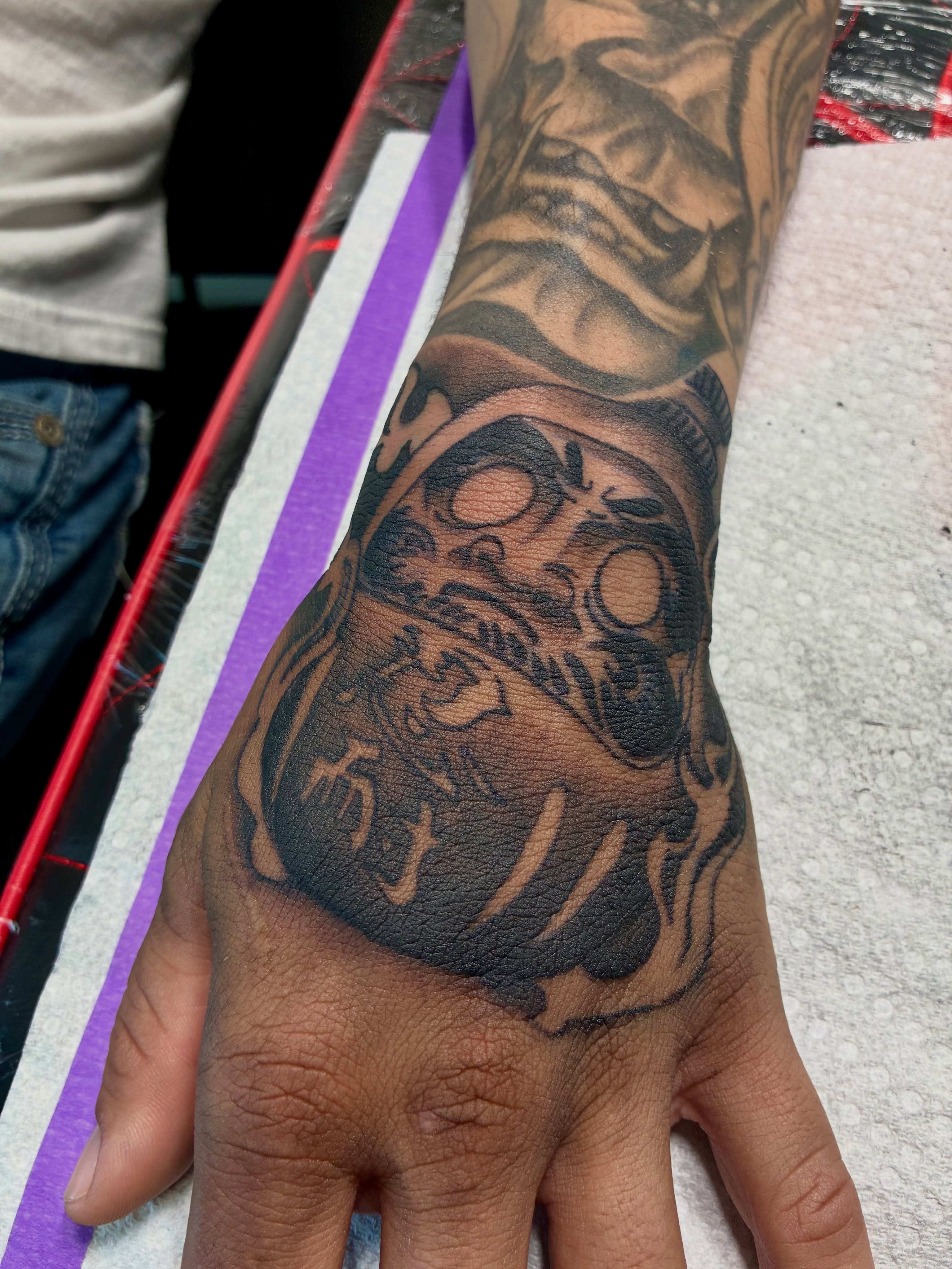 Skull black and grey tattoo on the hand by Nessa, Las Vegas, Nevada
