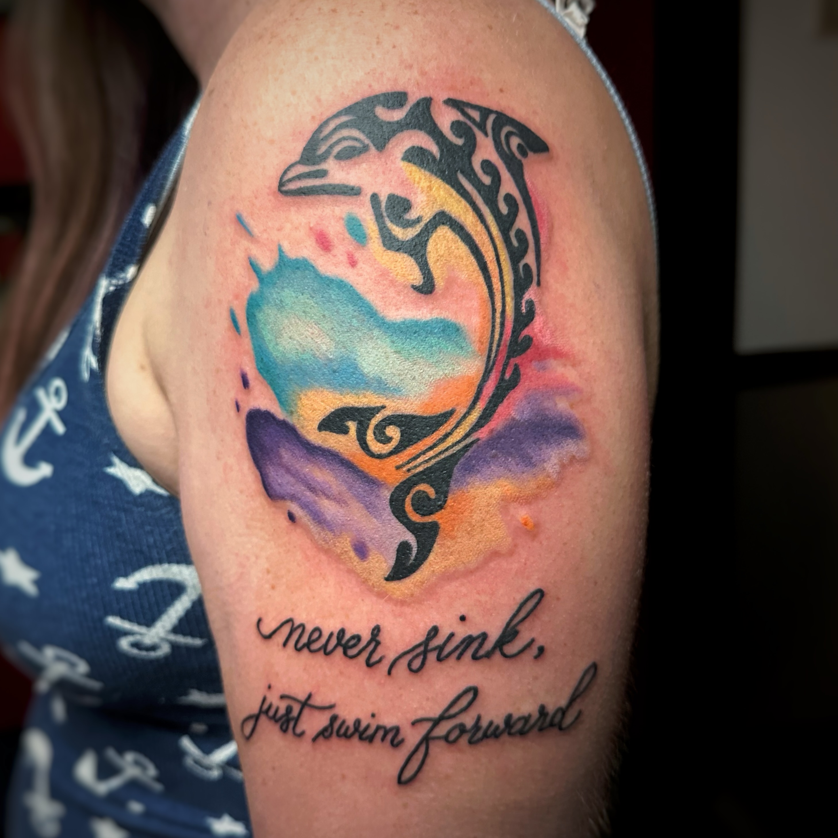 Dolphin tribal tattoo on the shoulder by Anthony Guido