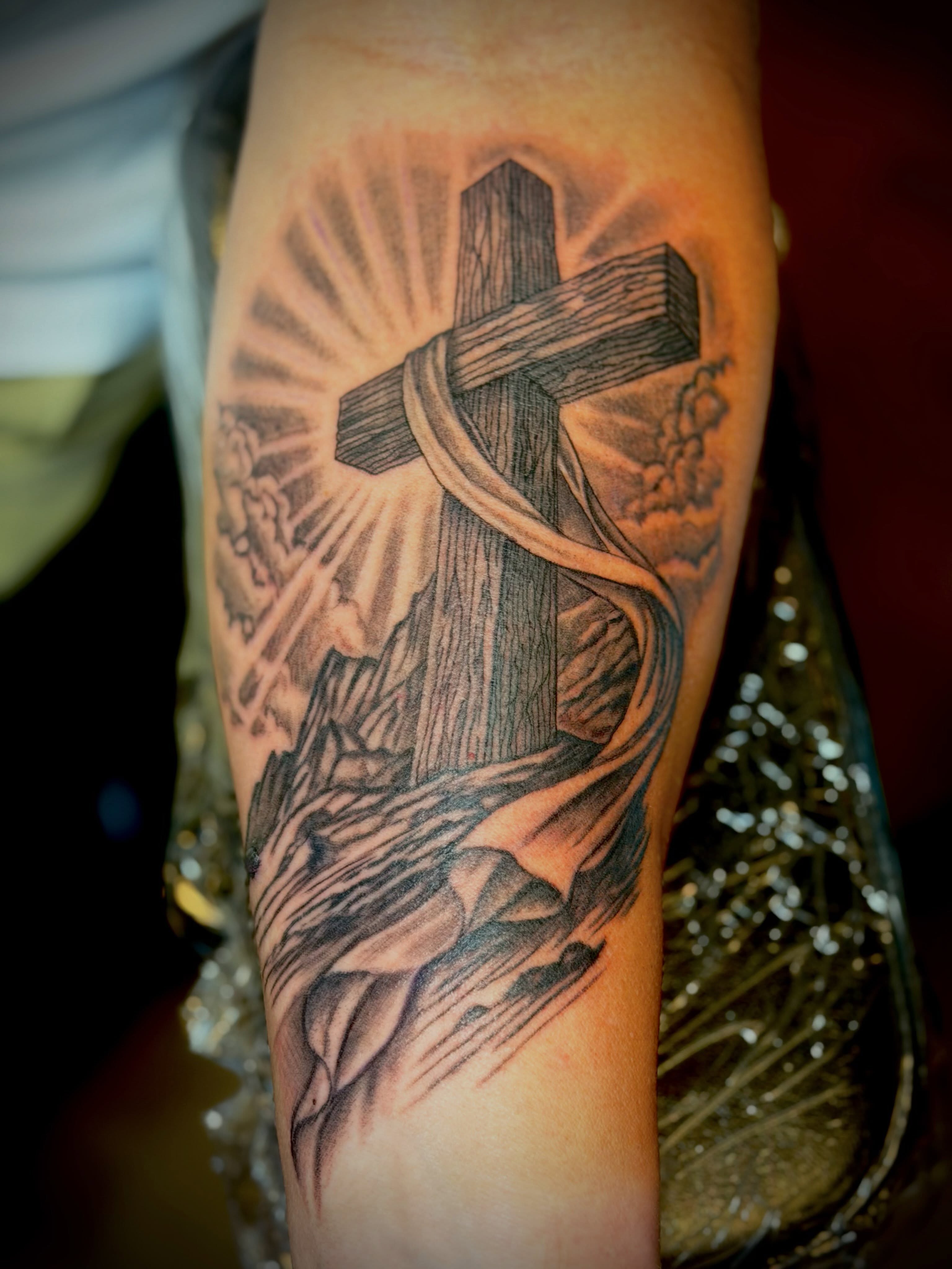Cross and DNA strand realism tattoo on the forearm by Joshua Ware, Alvarado, Texas