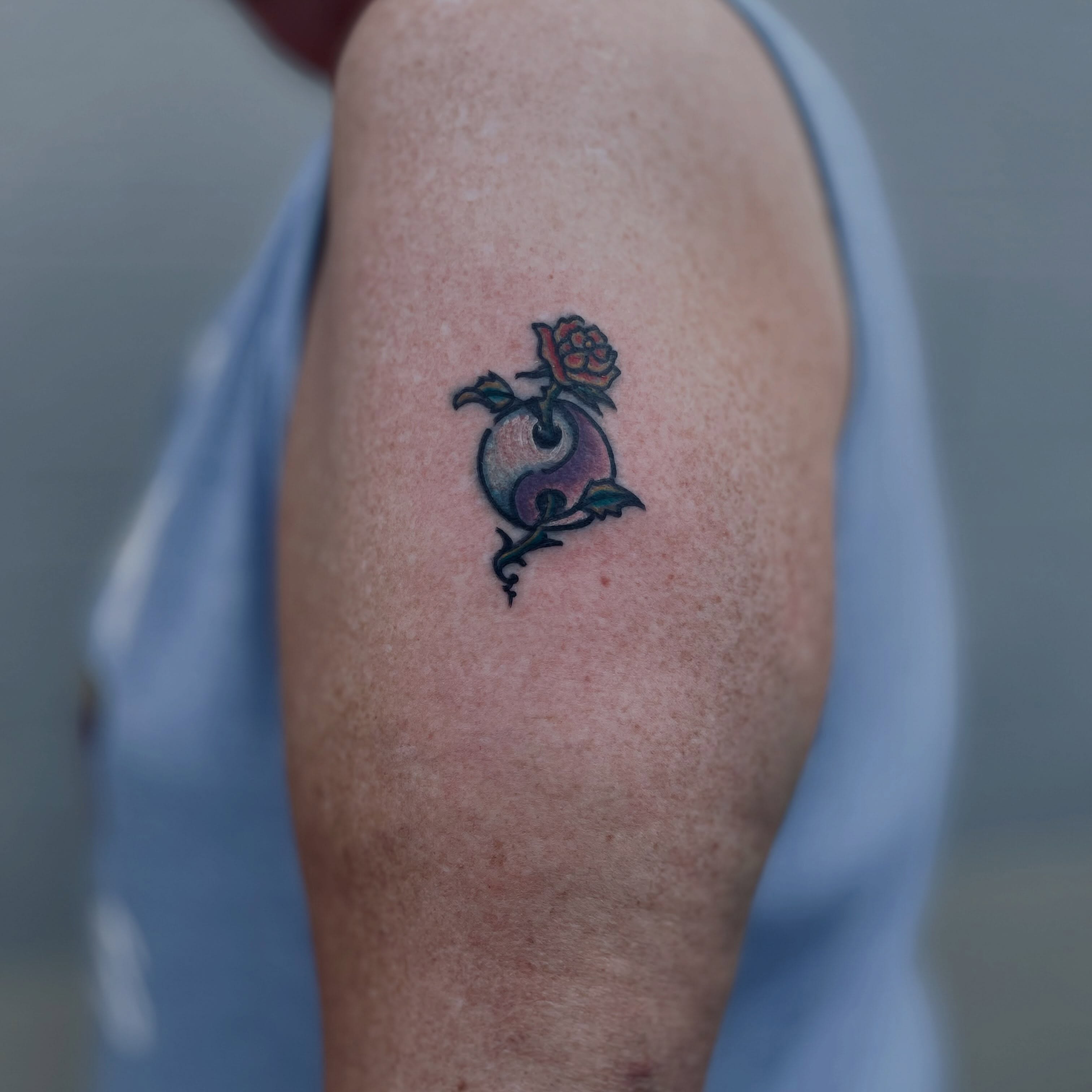 Rose and yin-yang neo-traditional tattoo on the forearm by Christien Xavier Alba, Salt Lake City, Utah