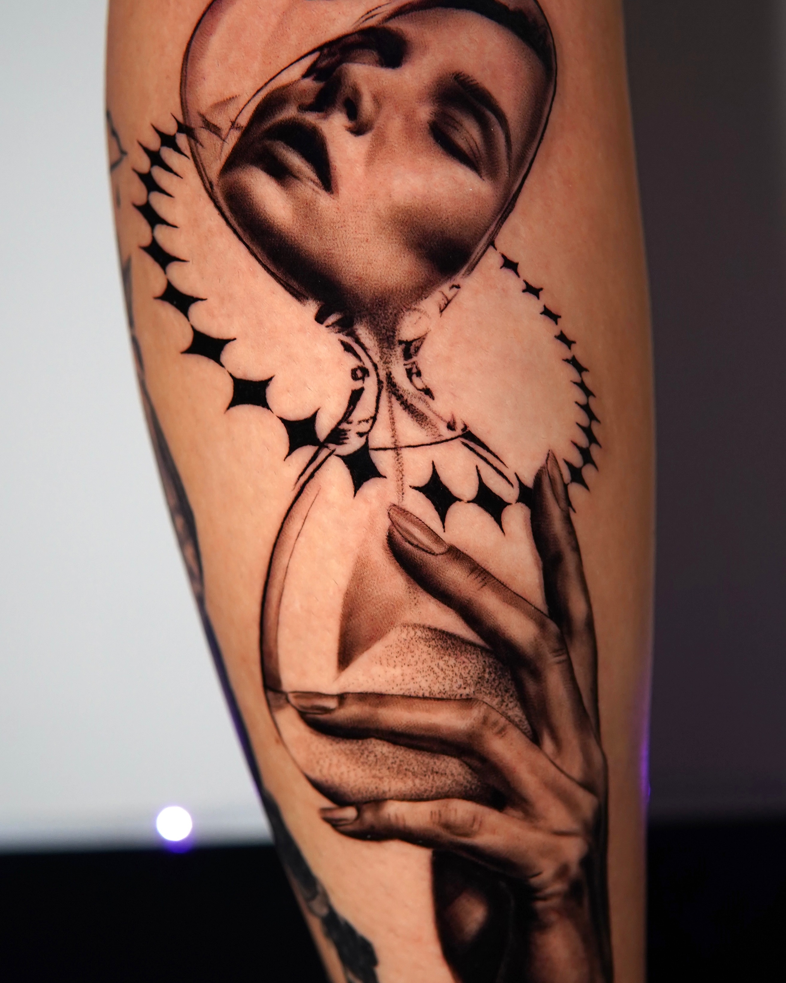 Angelic figure realism tattoo on the forearm by Marissa S., Lansing, Michigan