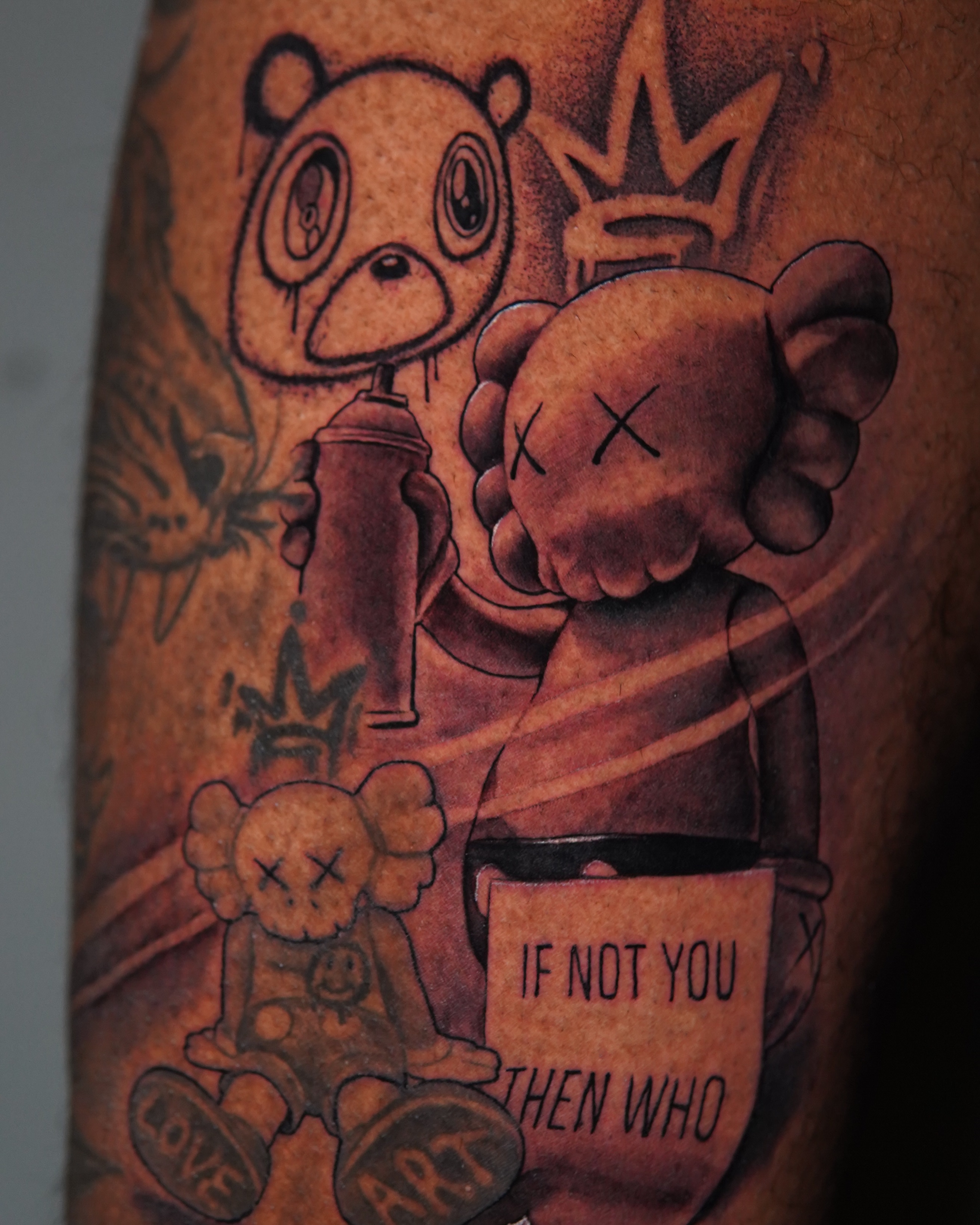 Kaws art black and grey tattoo on the forearm by Marissa S., Lansing, Michigan