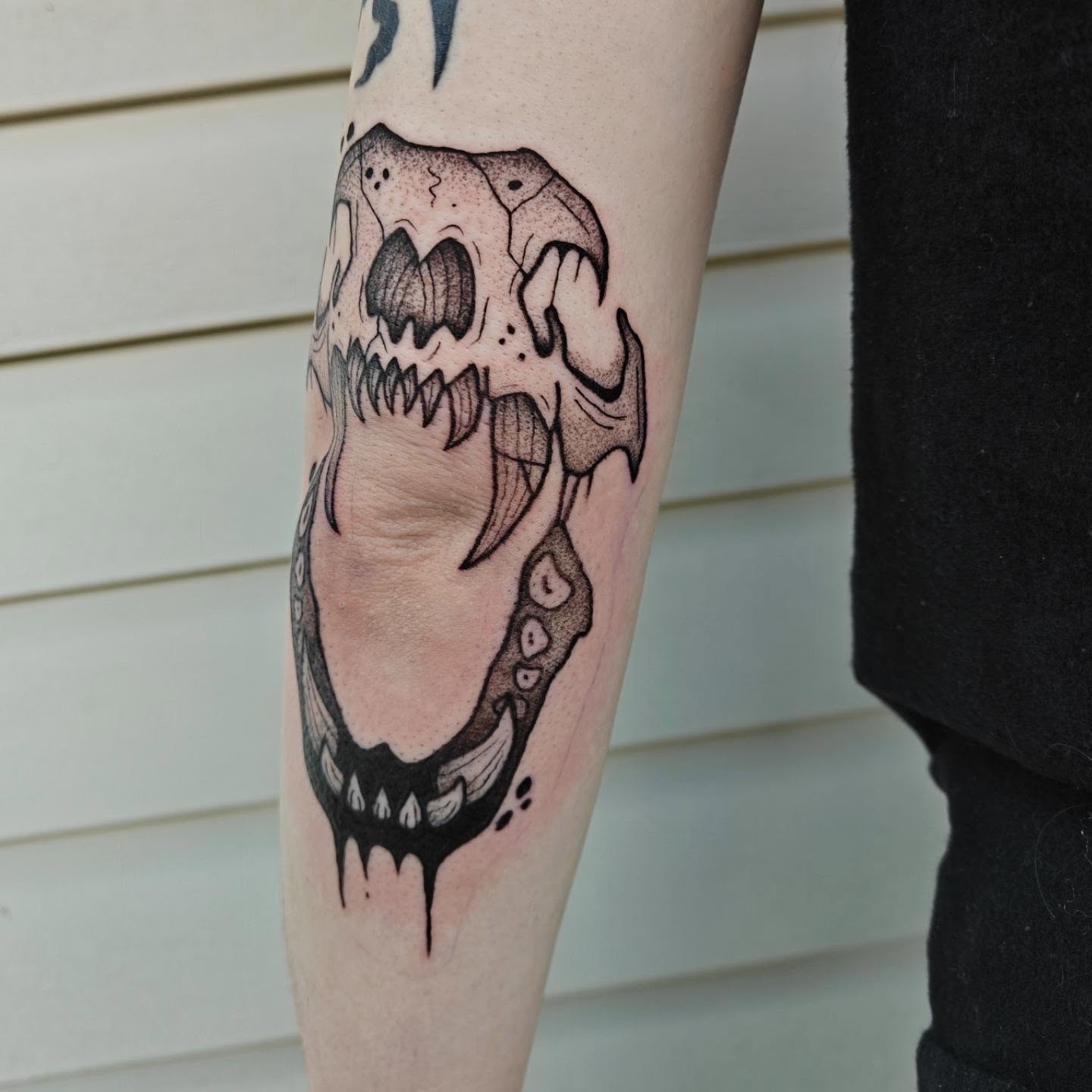 Skull dotwork tattoo on the forearm by Meg