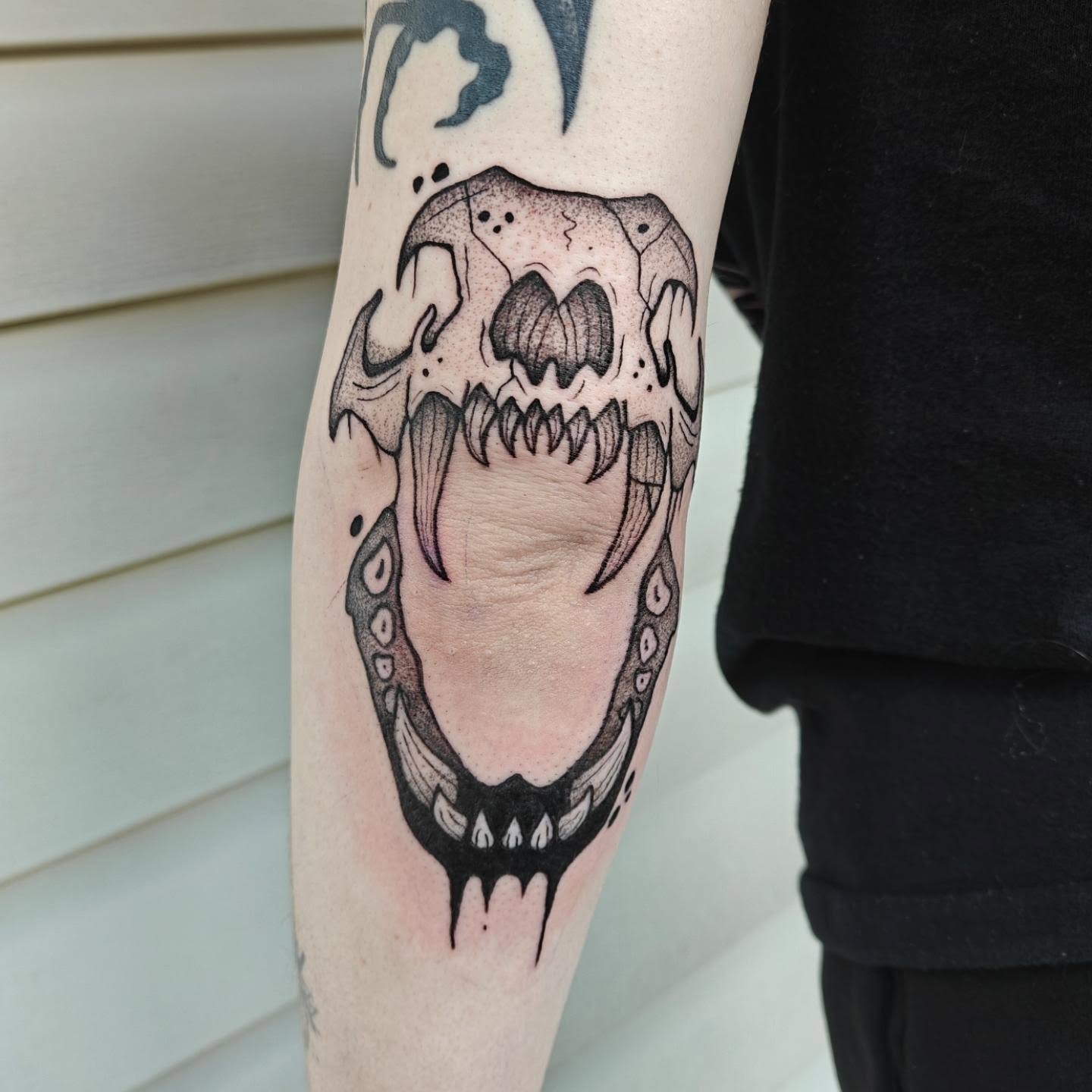 Skull dotwork tattoo on the forearm by Meg