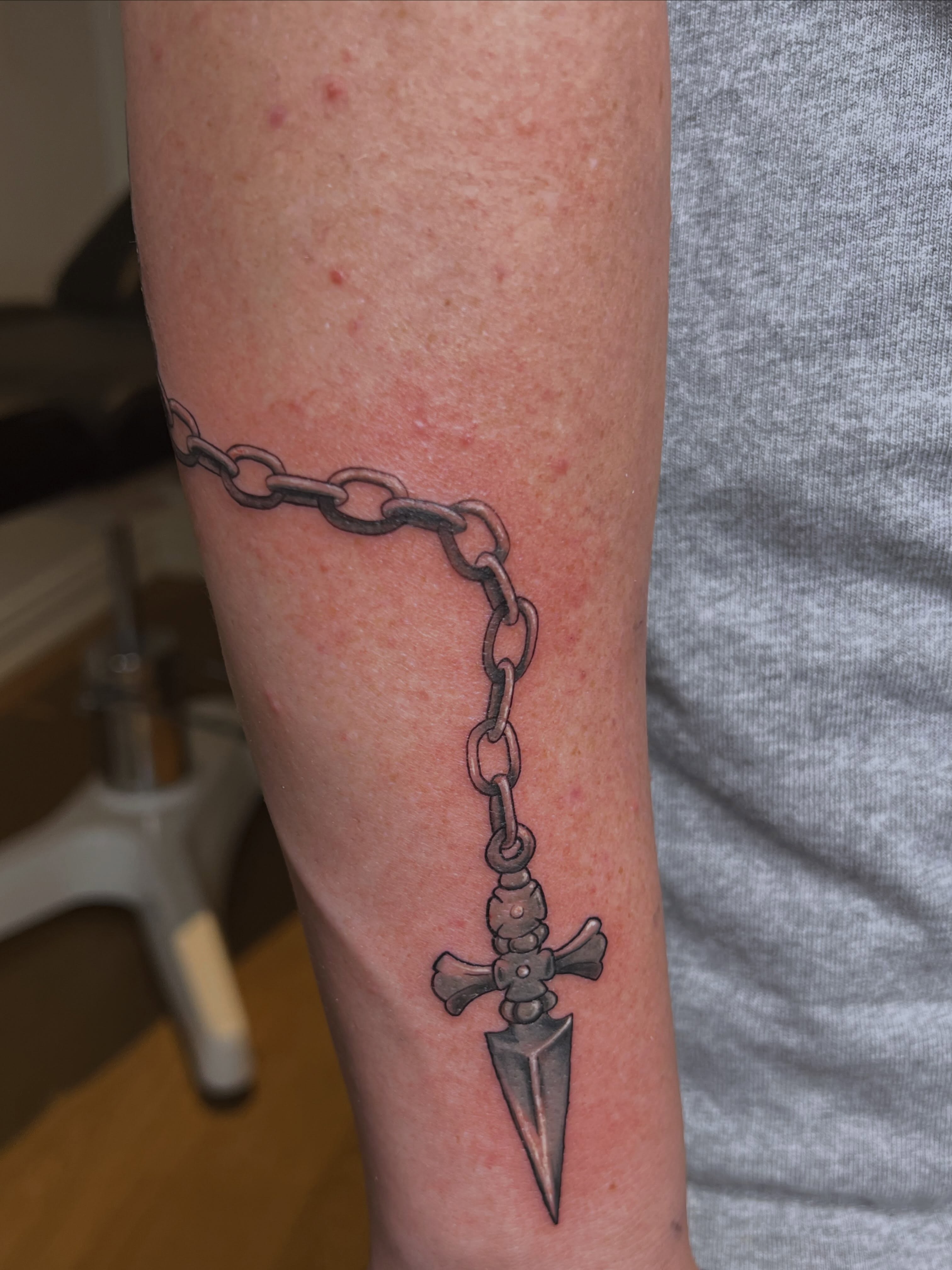 Chain and dagger black and grey tattoo on the forearm by Juan pablo, Toronto, Ontario