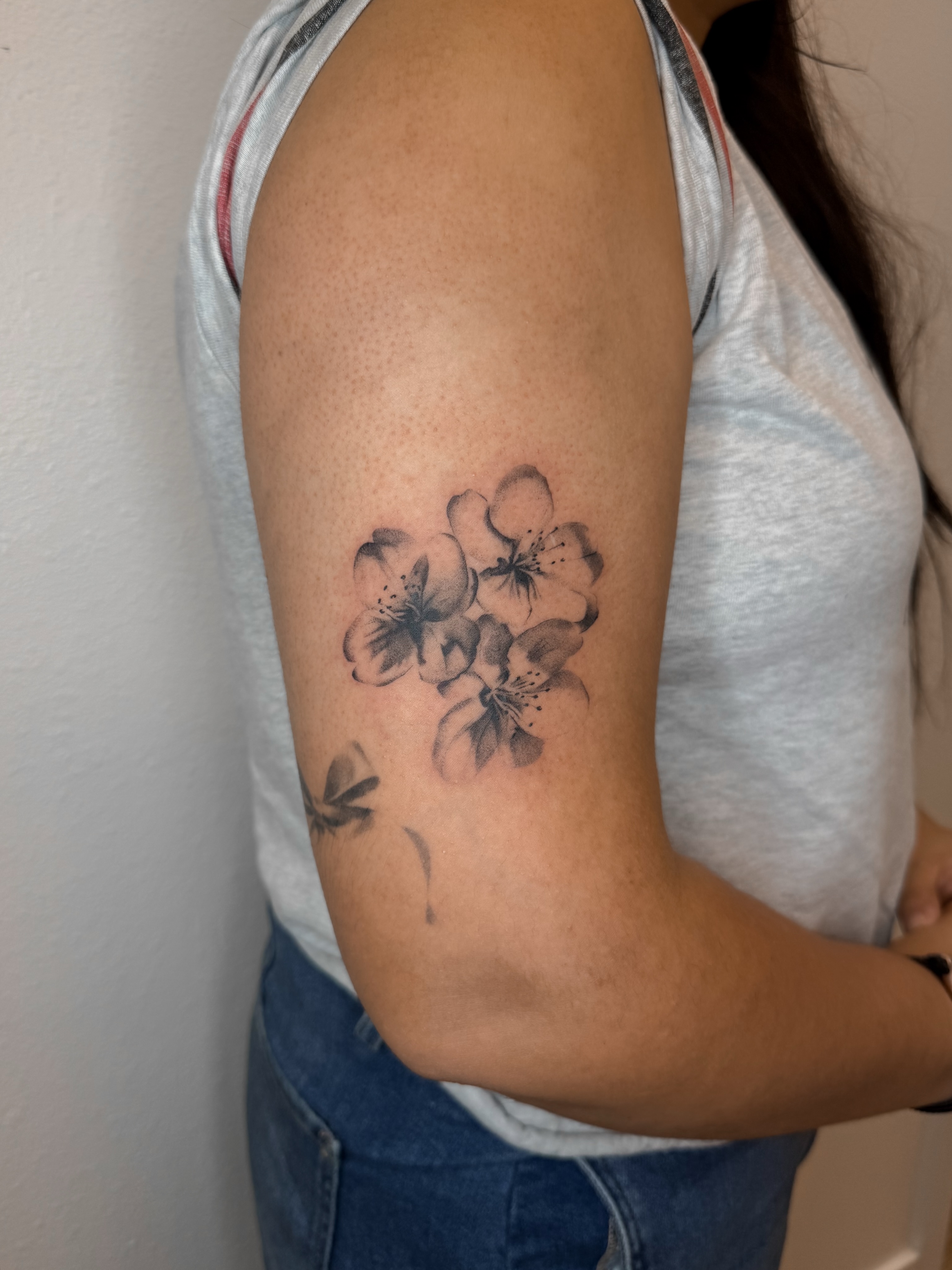 Cherry blossoms black and grey tattoo on the forearm by Rylee