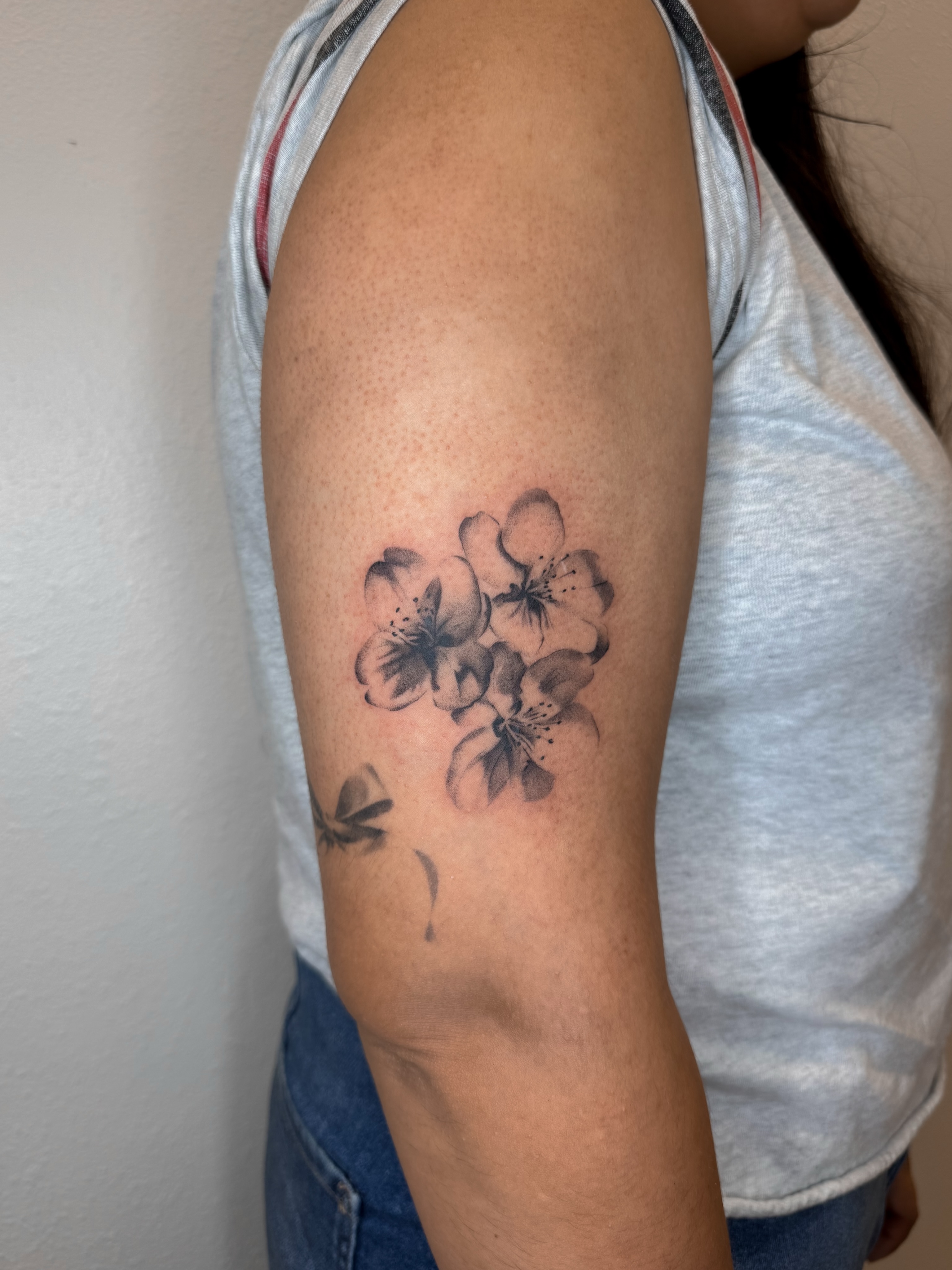 Cherry blossoms black and grey tattoo on the forearm by Rylee