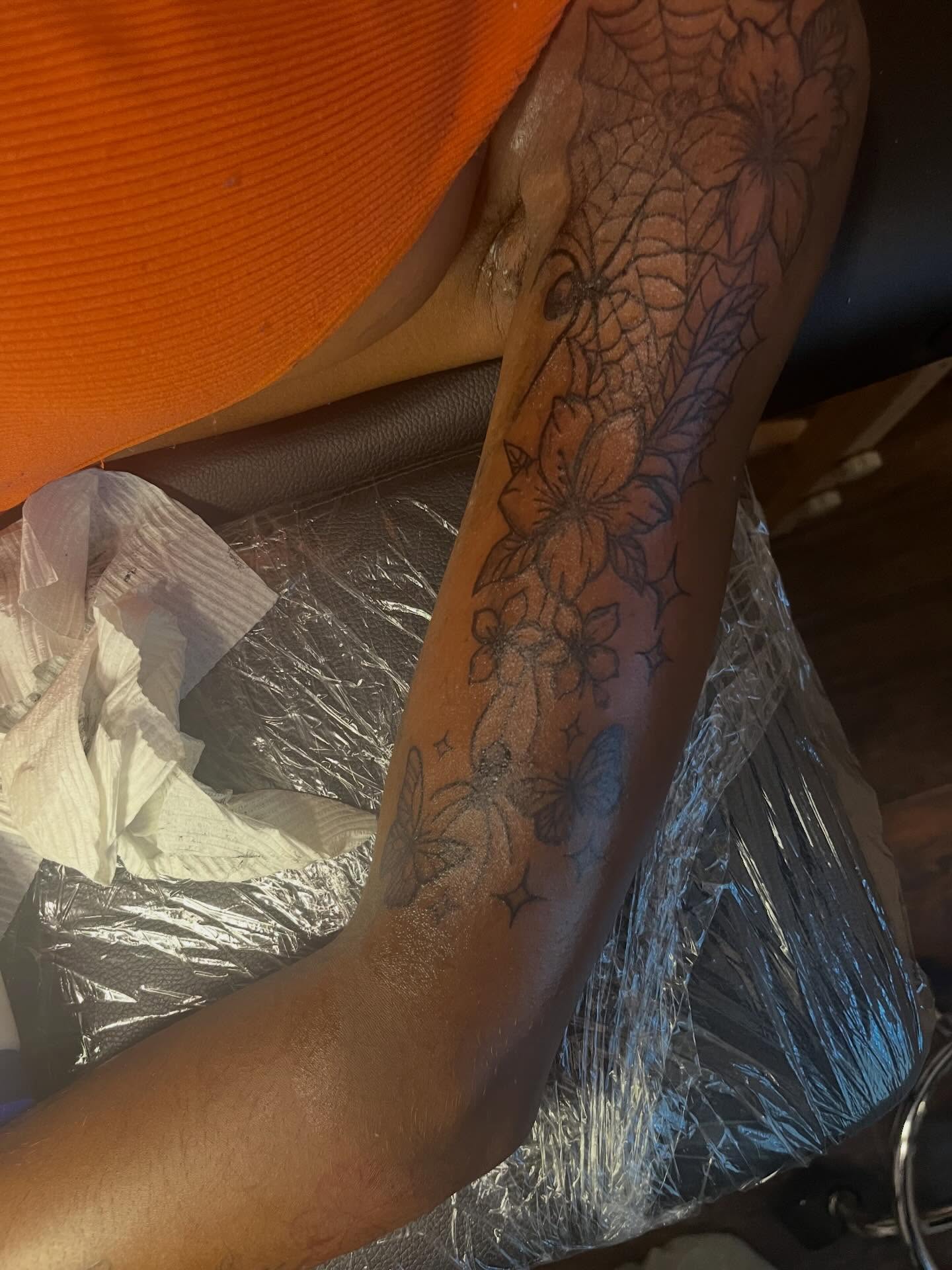 Flowers and butterflies black and grey tattoo on the forearm by π Westside