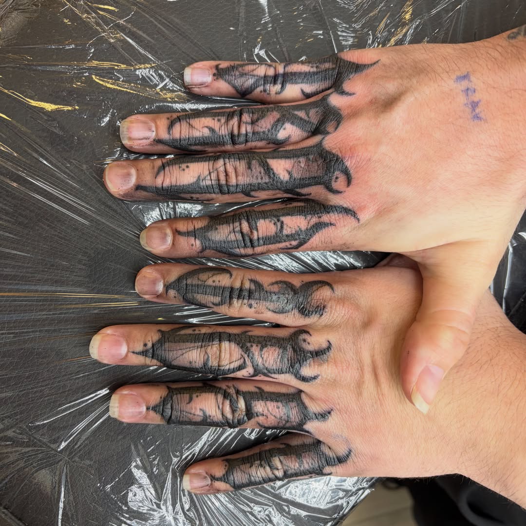 Hands black and grey tattoo on the hand by Haley