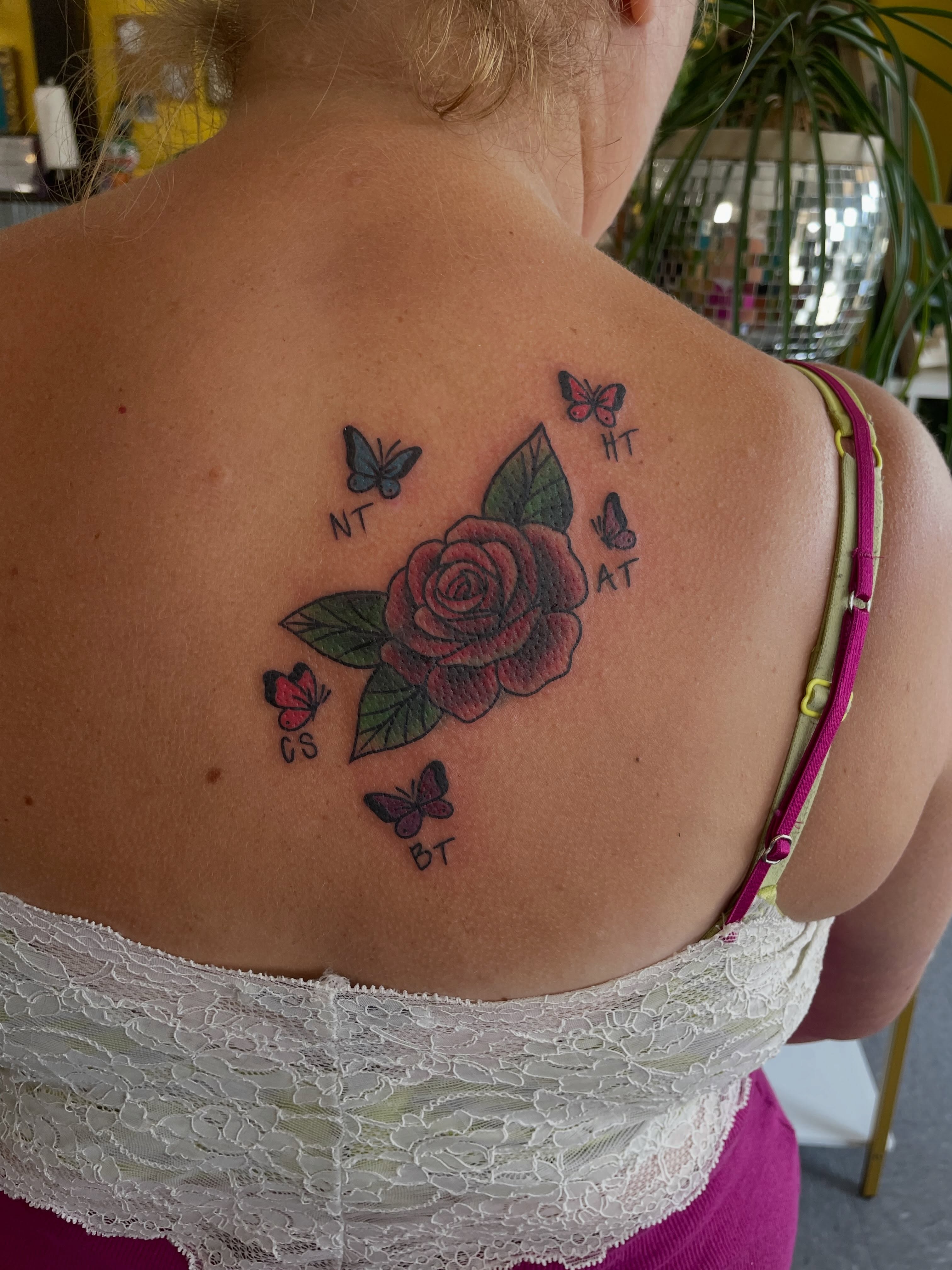 Rose and butterflies American traditional tattoo on the back by Mallory Moore