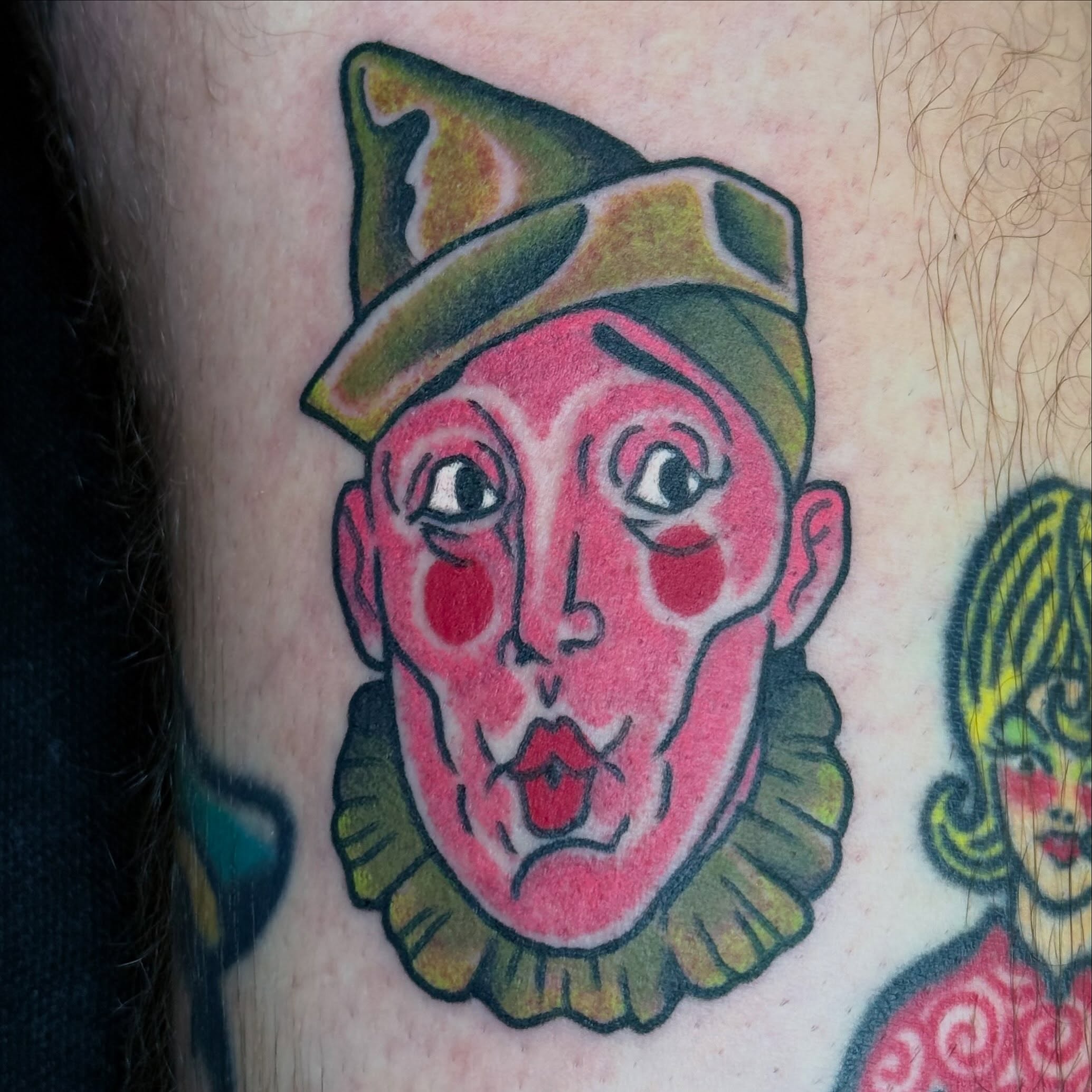 Clown face American traditional tattoo on the forearm by Timothy Kenee