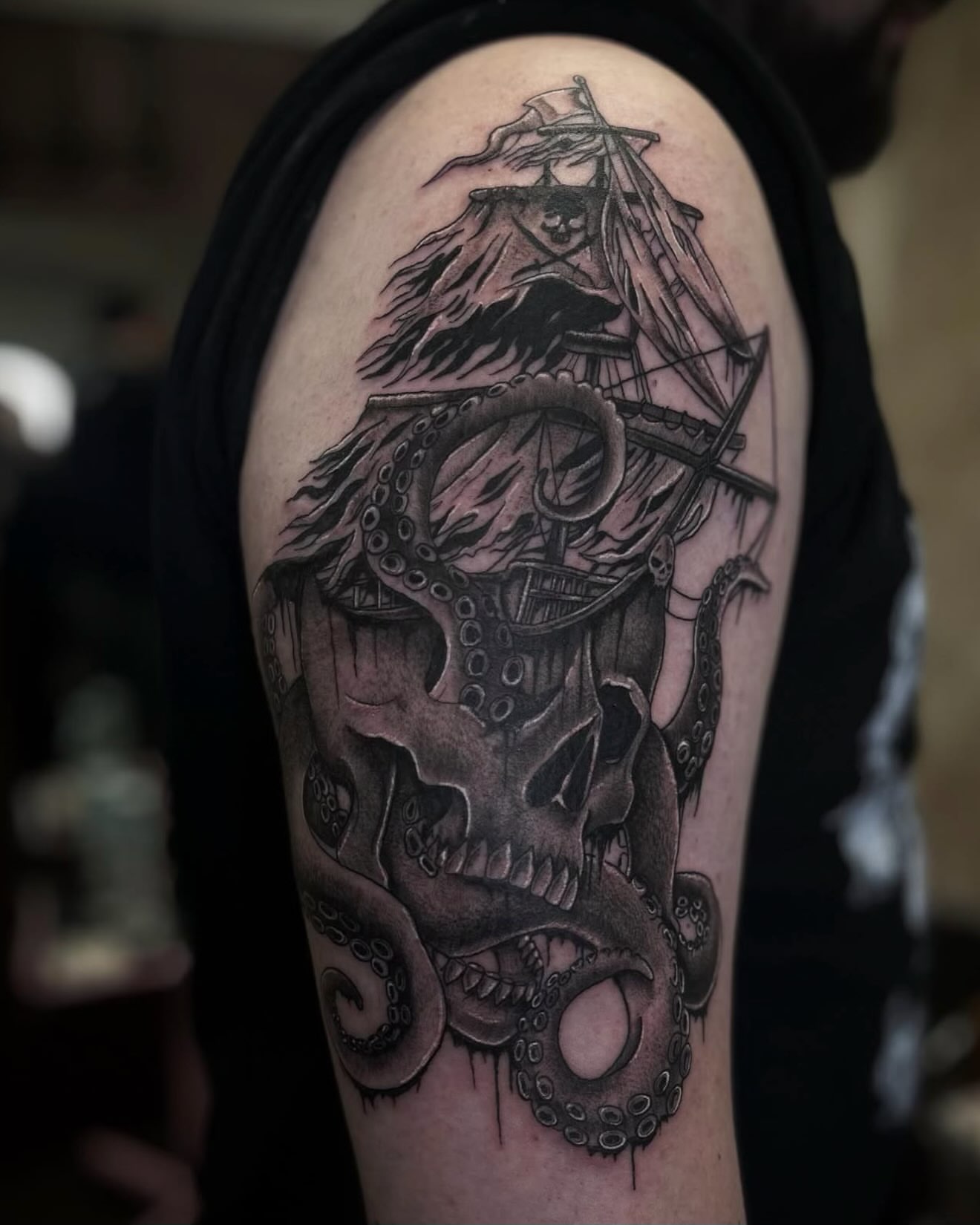 Ship and octopus realism tattoo on the shoulder by Angie Milano