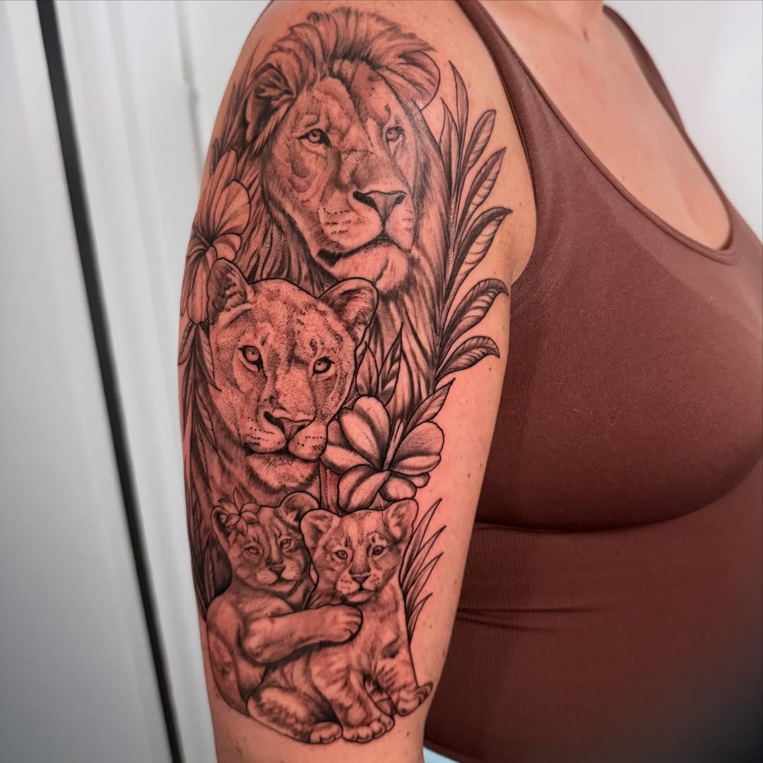 Lion family realism tattoo on the forearm by Liz Aulenbacher