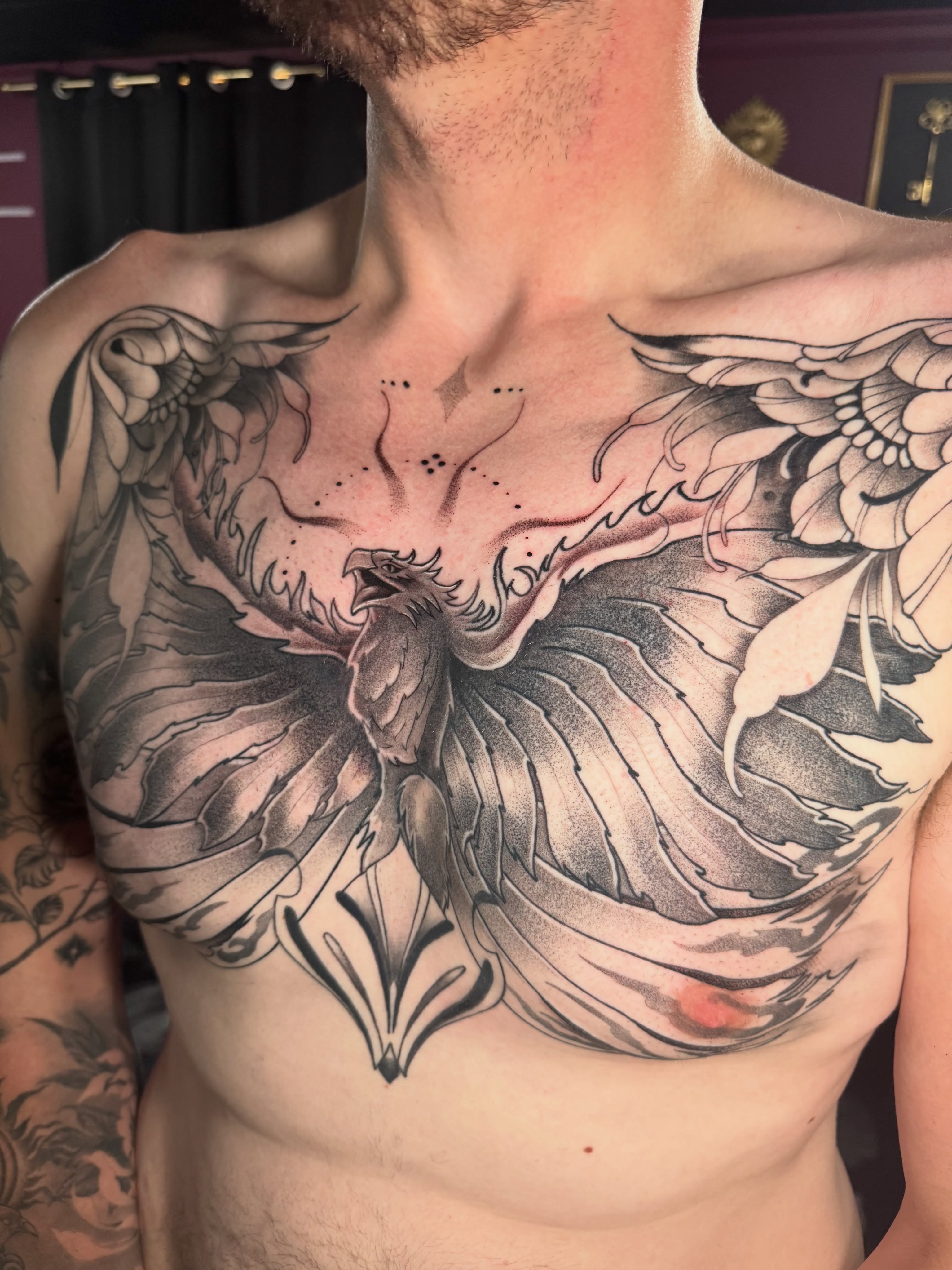 Phoenix realism tattoo on the chest by Dante Singh