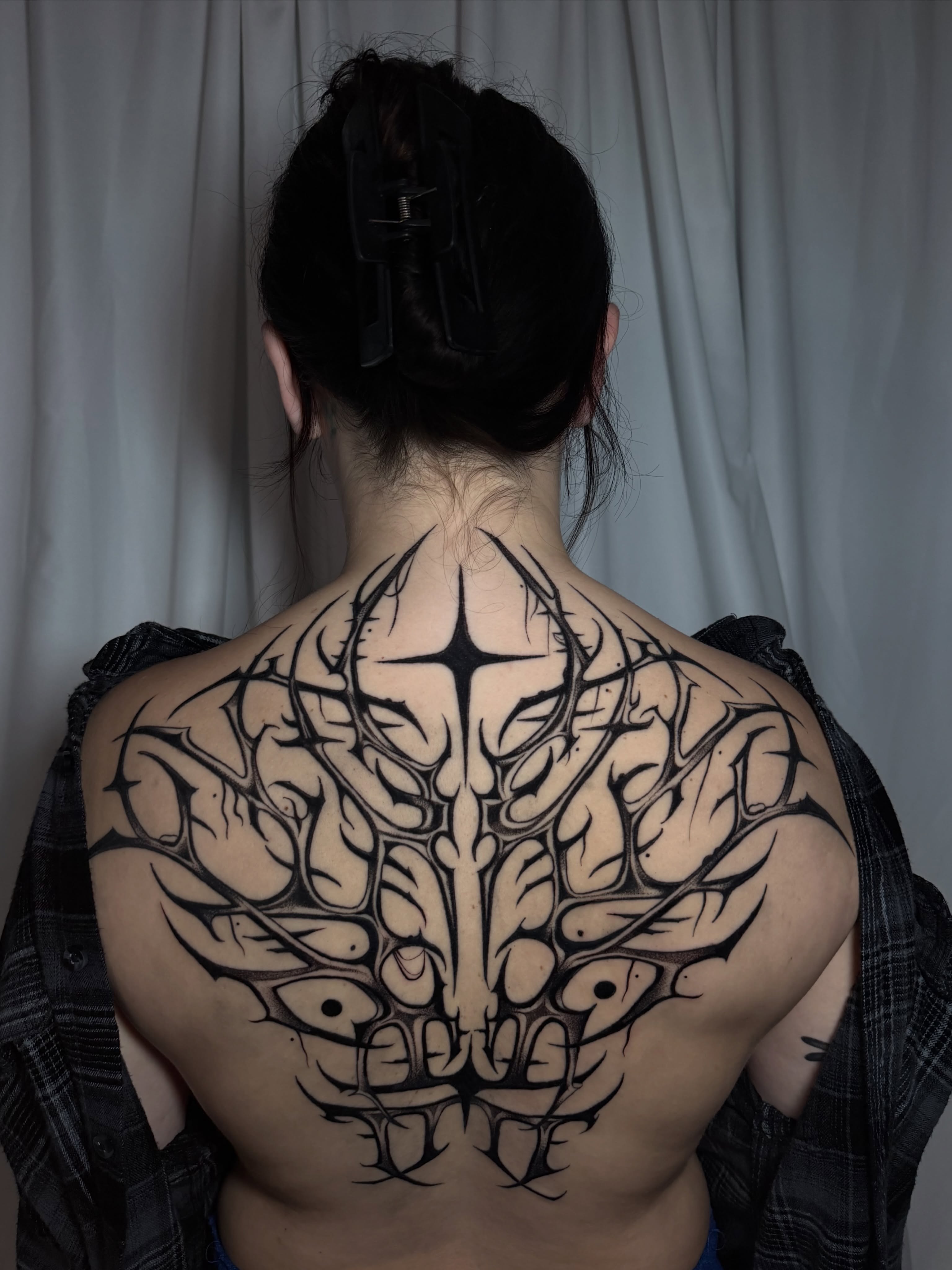 Spine tribal tattoo on the back by Marlee Natale, Pinellas Park, Florida