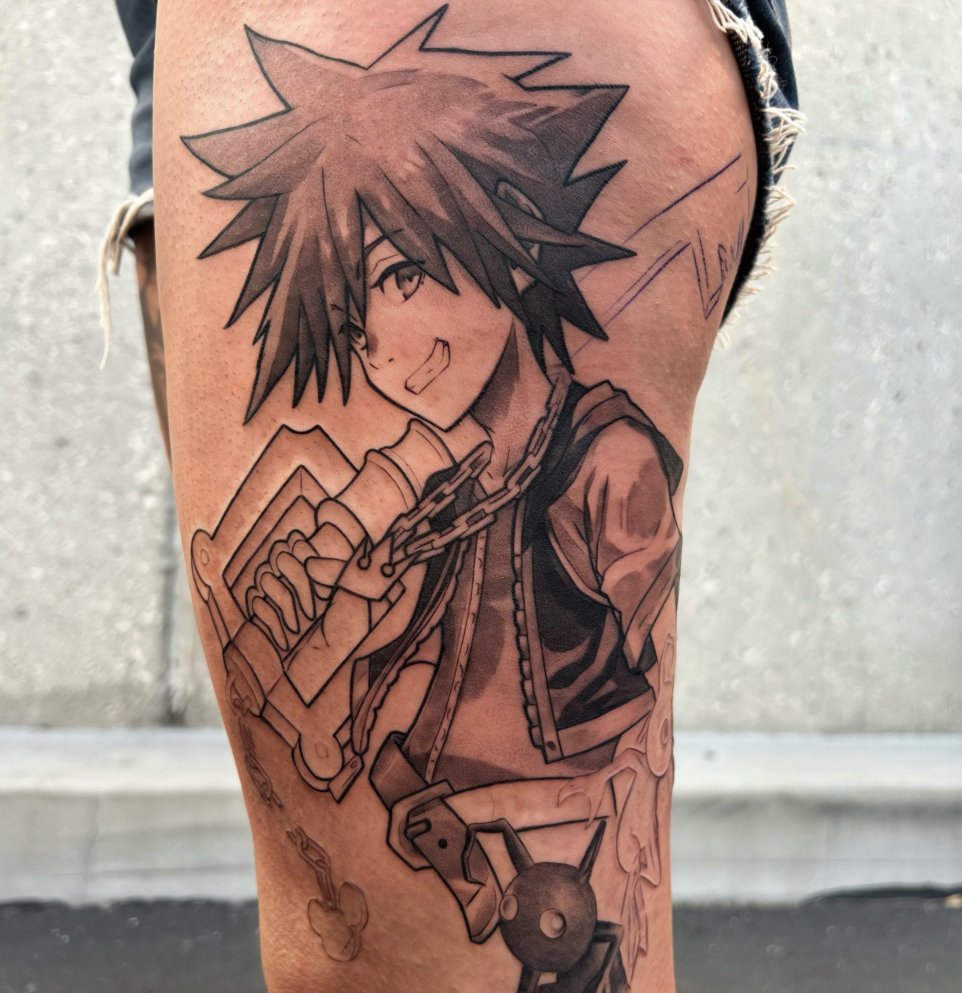 Sora from kingdom hearts anime tattoo on the thigh by Tattoos by Anthony Davis