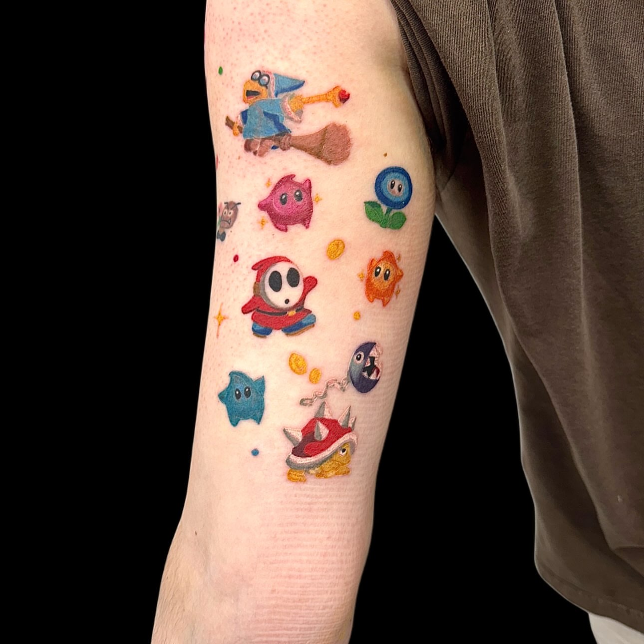 Kirby and friends dotwork tattoo on the forearm by Abby Ash, Belington, West Virginia