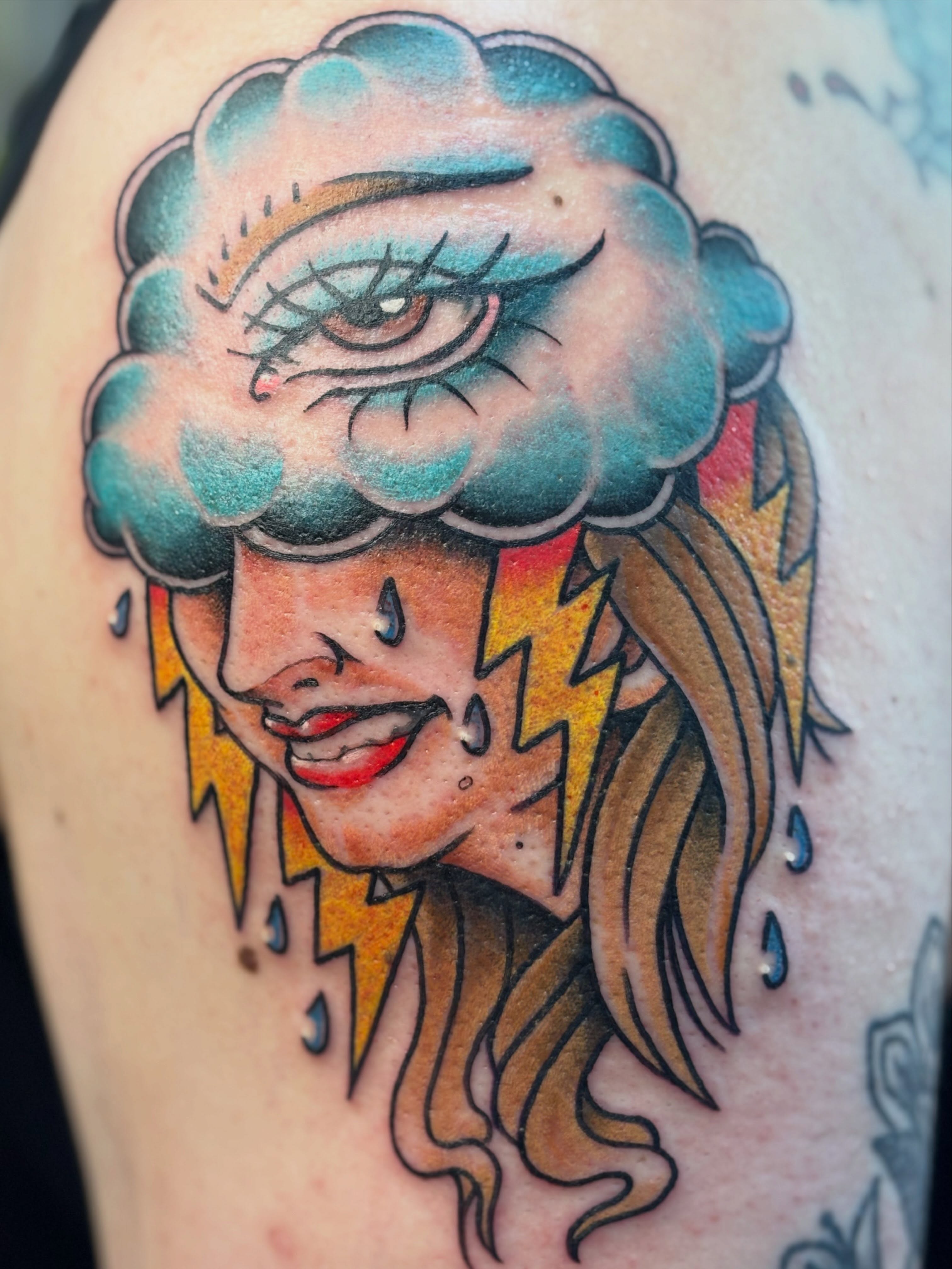 Storm cloud woman American traditional tattoo on the shoulder by Nick Tate