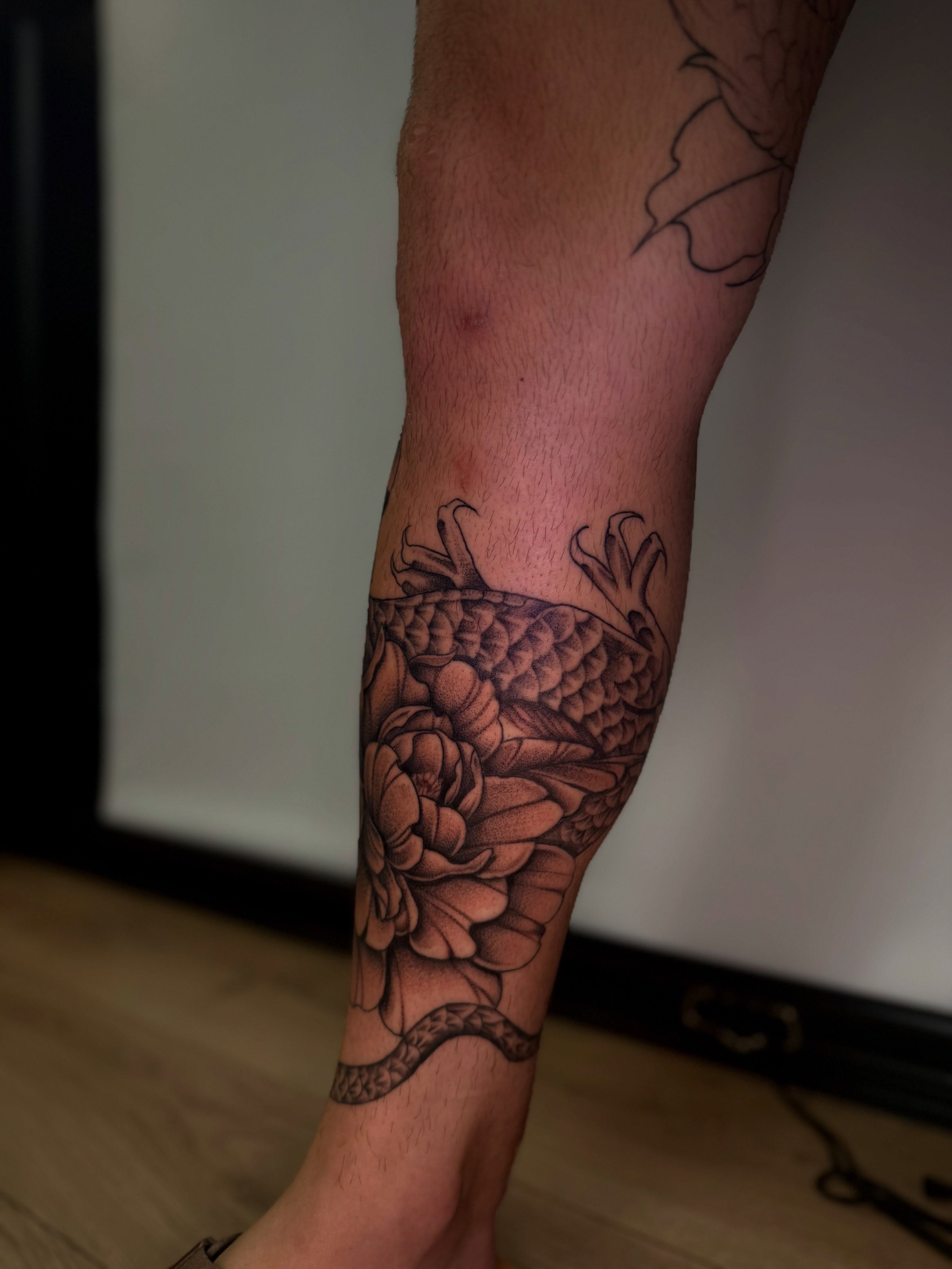 Peony and dragon American traditional tattoo on the forearm by Penny - Tattooer
