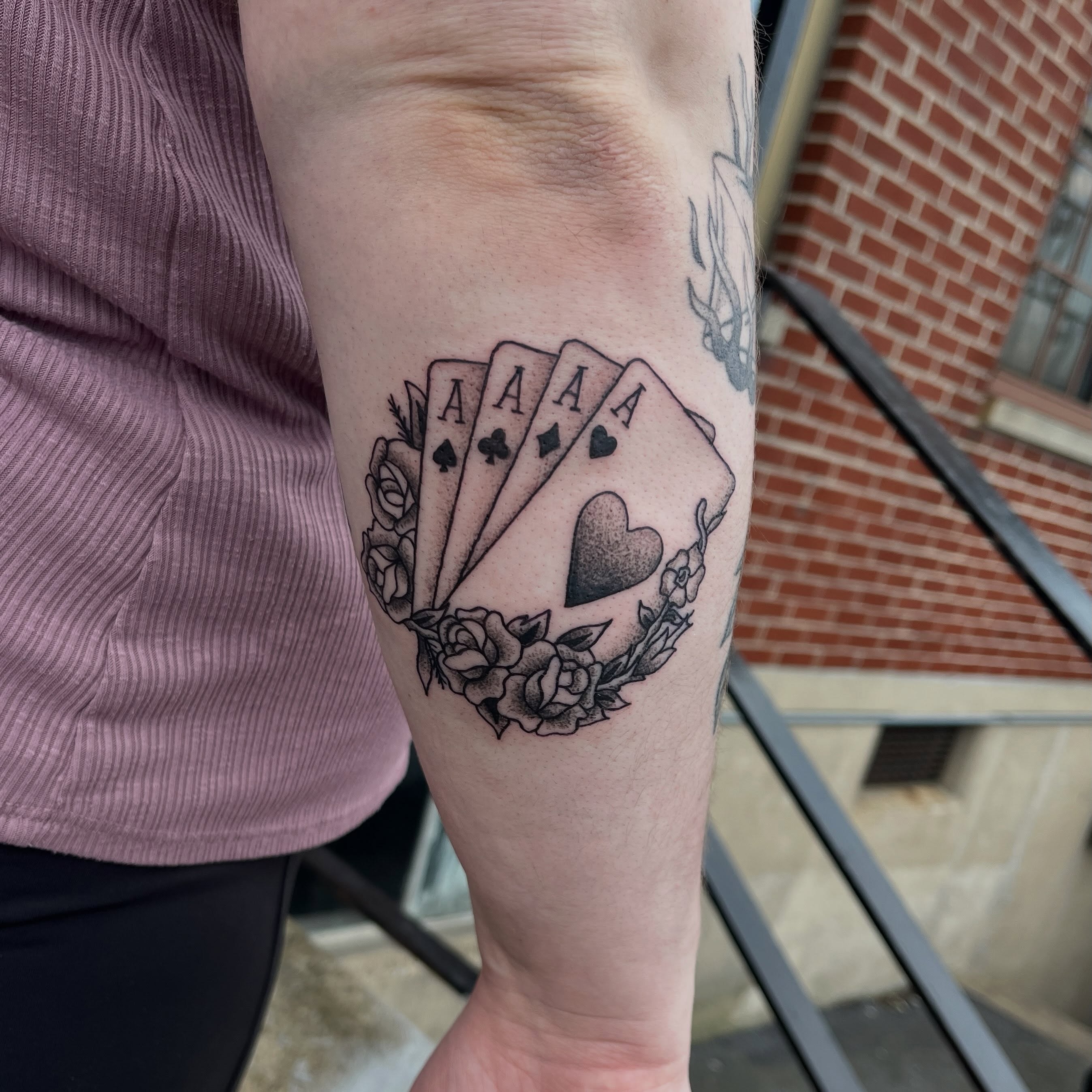 Playing cards American traditional tattoo on the forearm by sarah