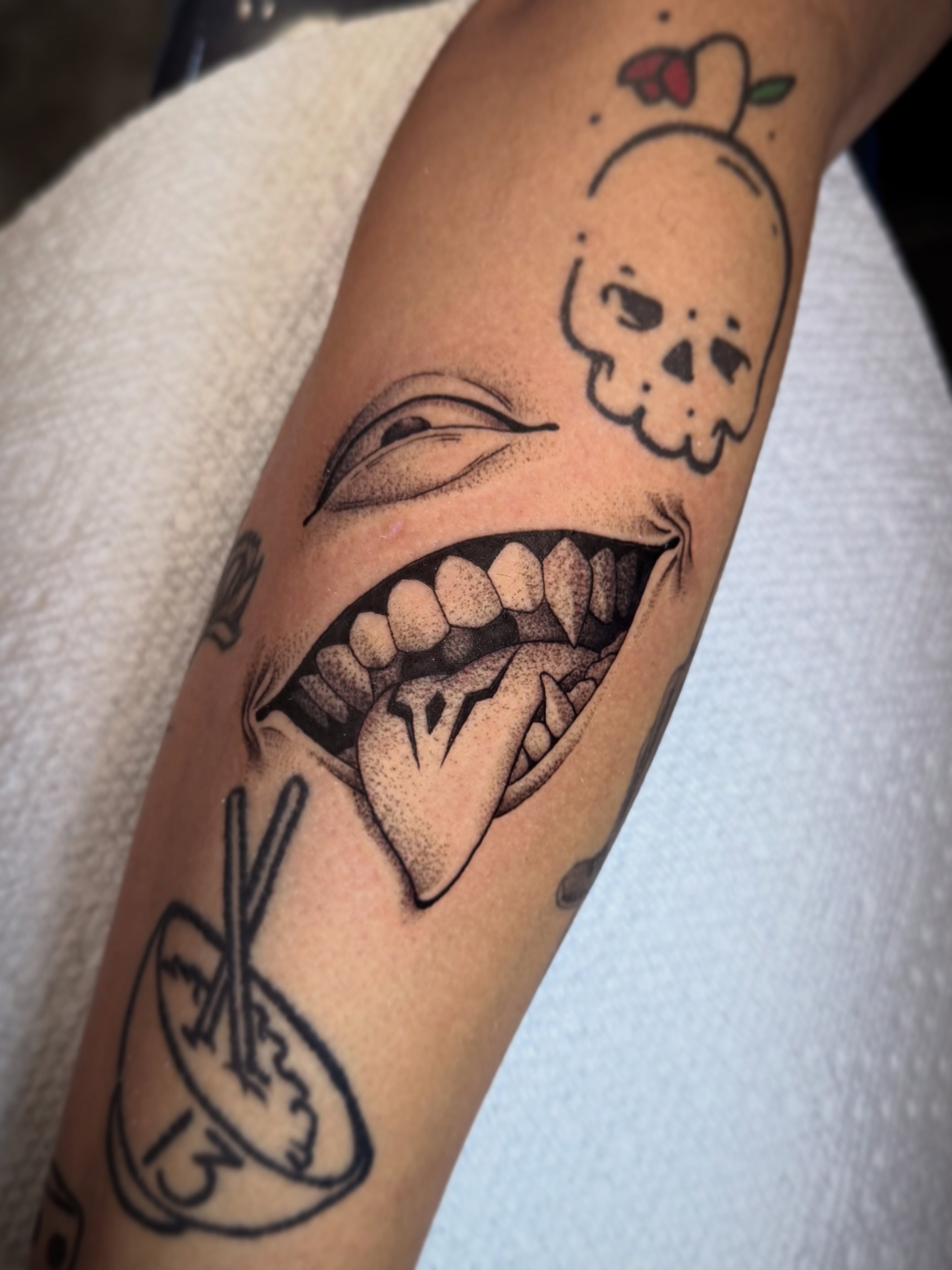 Grinning mouth dotwork tattoo on the forearm by Seth Mullin, Hemet, California