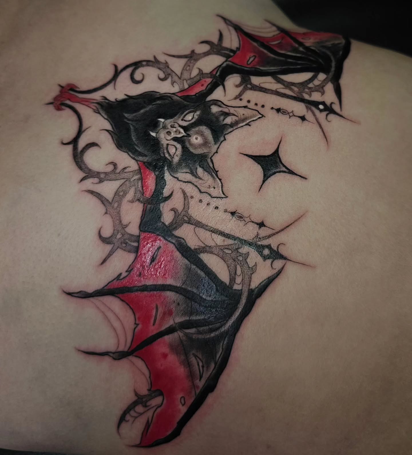 Vampire dark realism tattoo on the back by Ella Trick