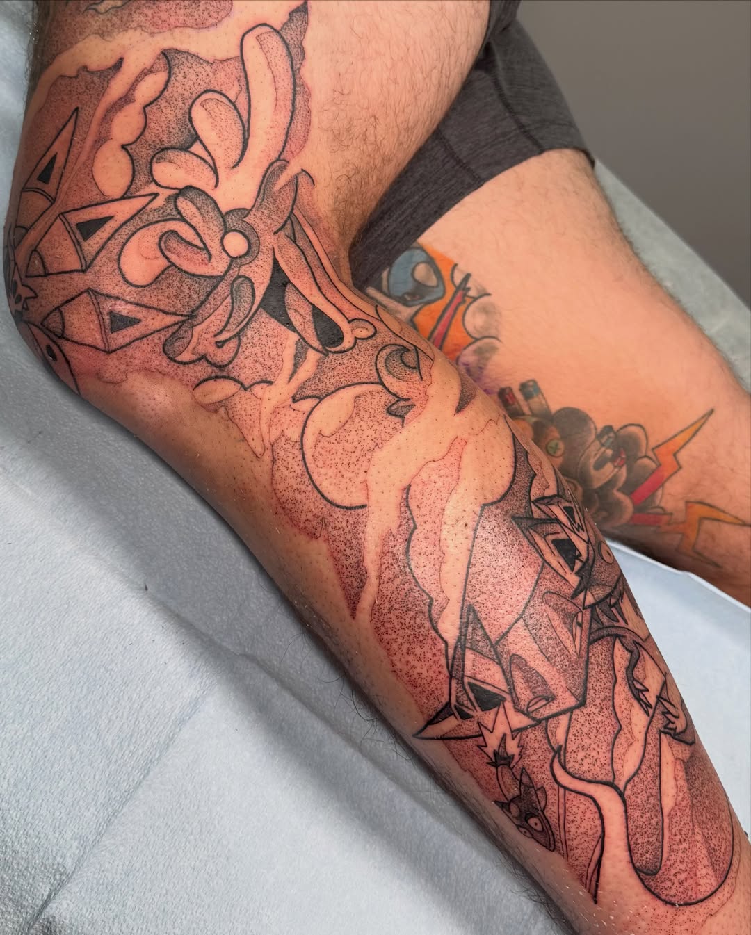 Abstract floral design dotwork tattoo on the forearm by Mike Corn