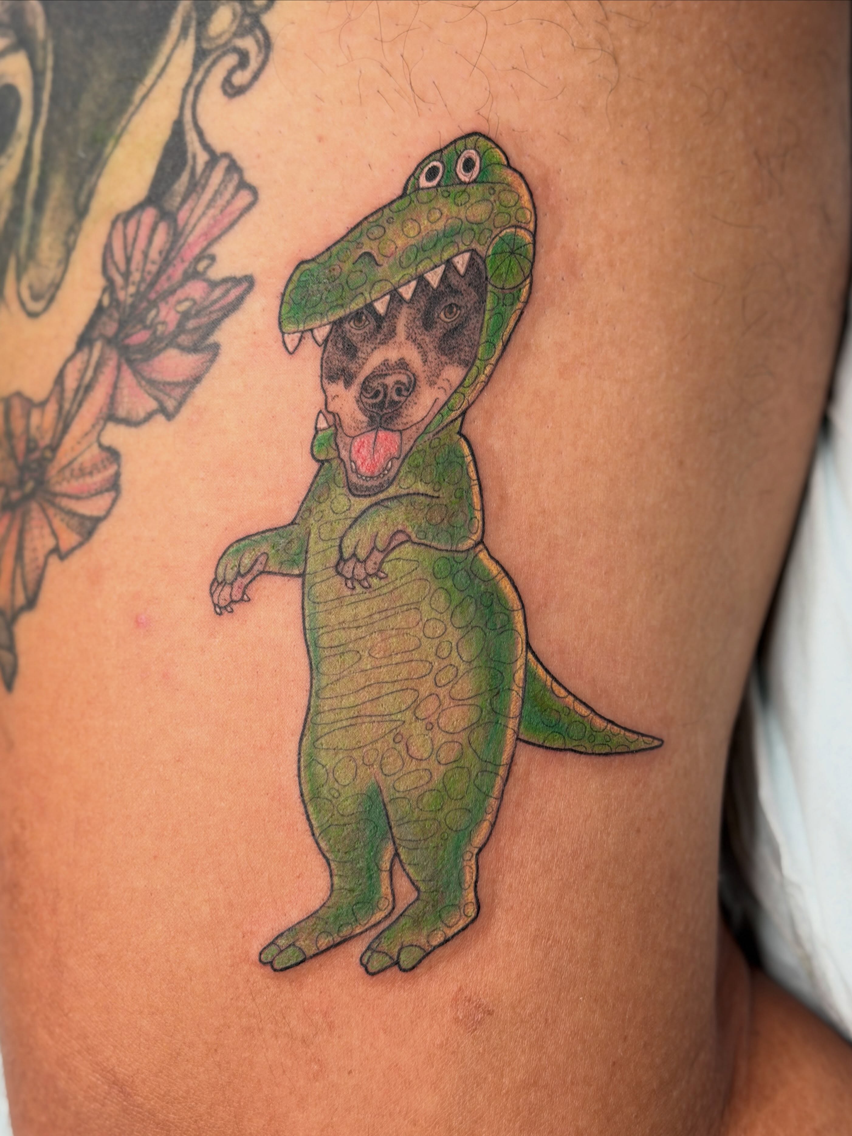 Dog in dinosaur costume dotwork tattoo on the thigh by Alison (Wise) Best