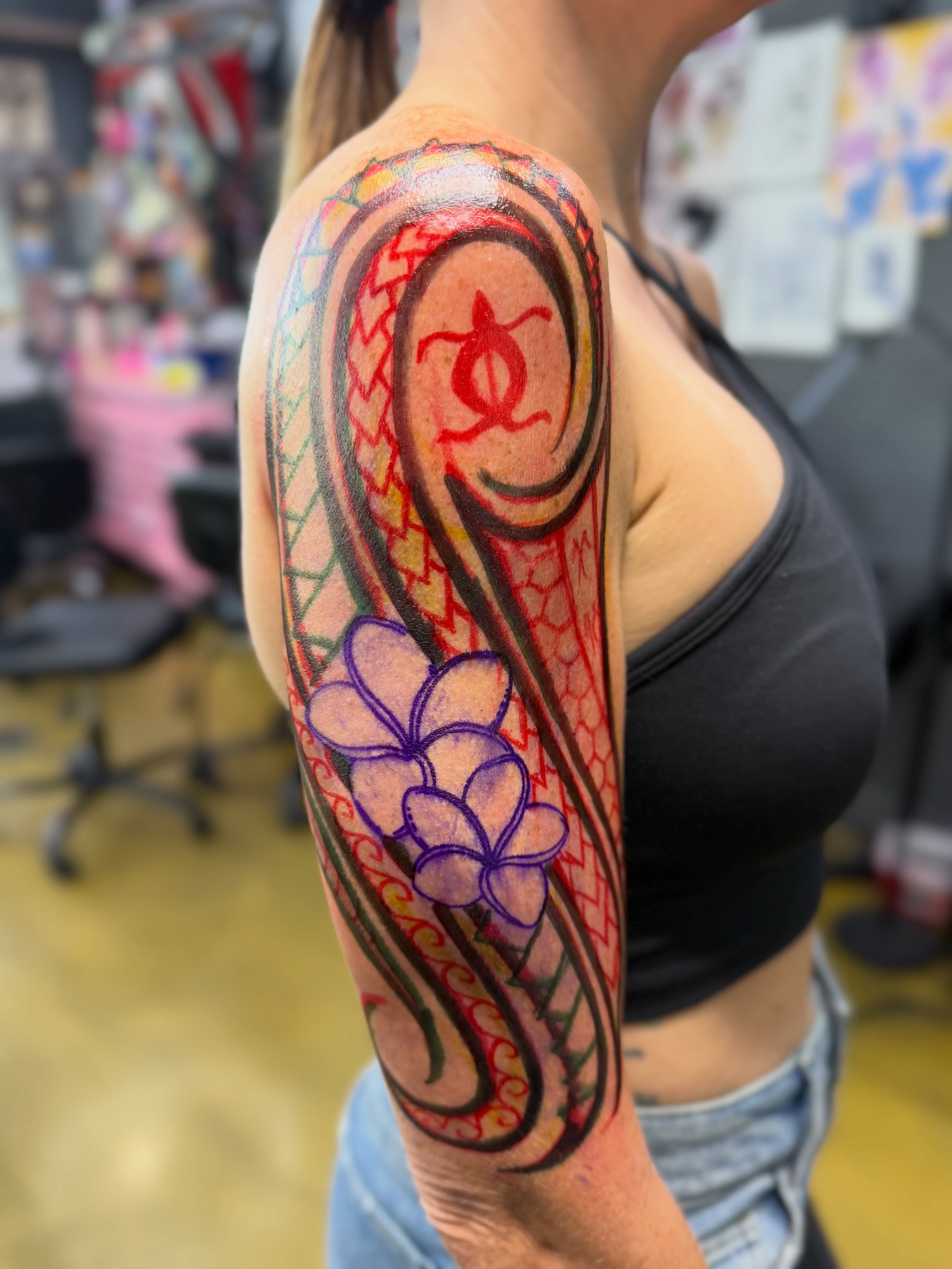 Plumeria flowers tribal tattoo on the forearm by Shawn “Kluch” Hutto