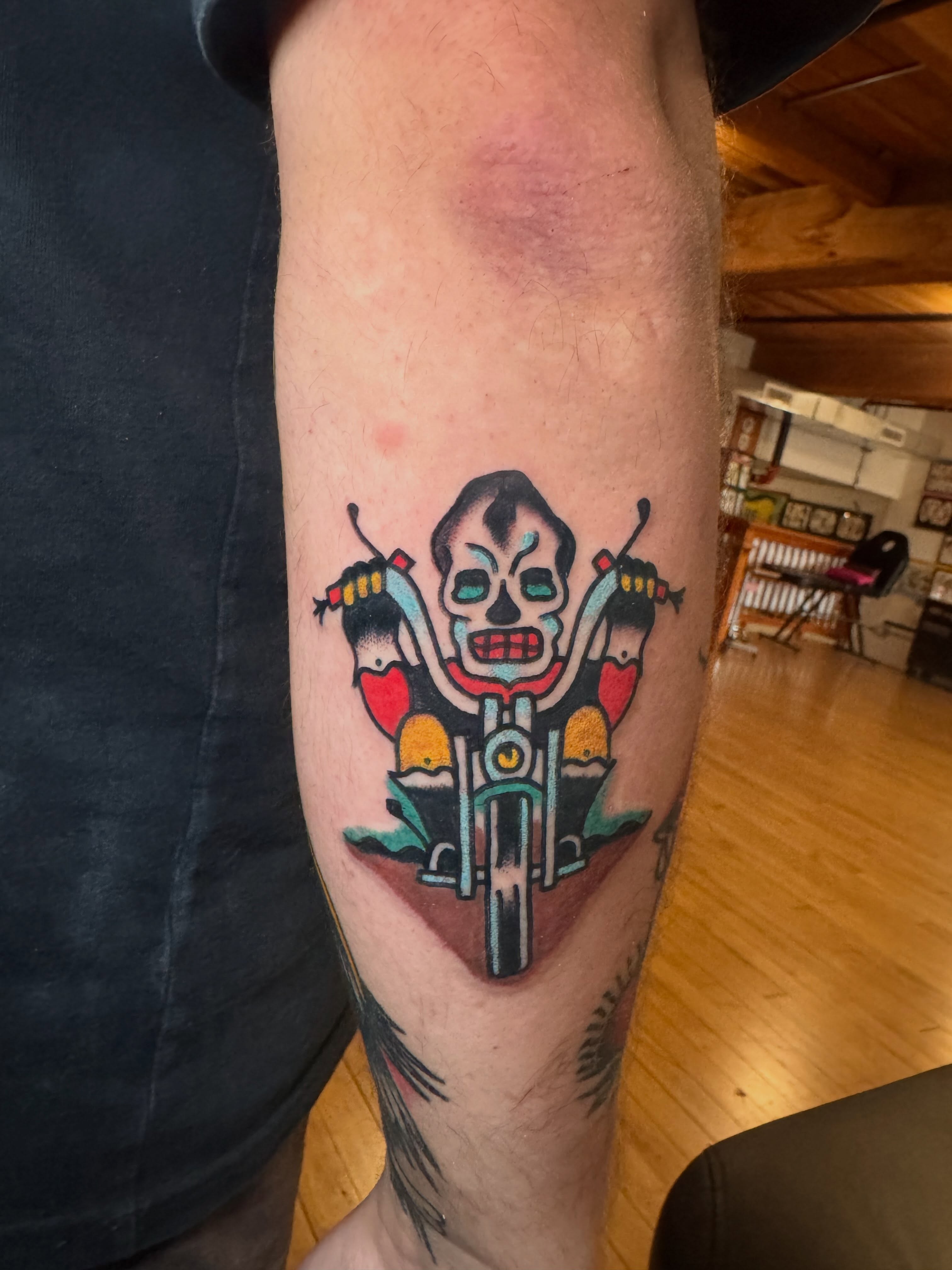 Motorcycle skeleton American traditional tattoo on the forearm by Zach Lemieux