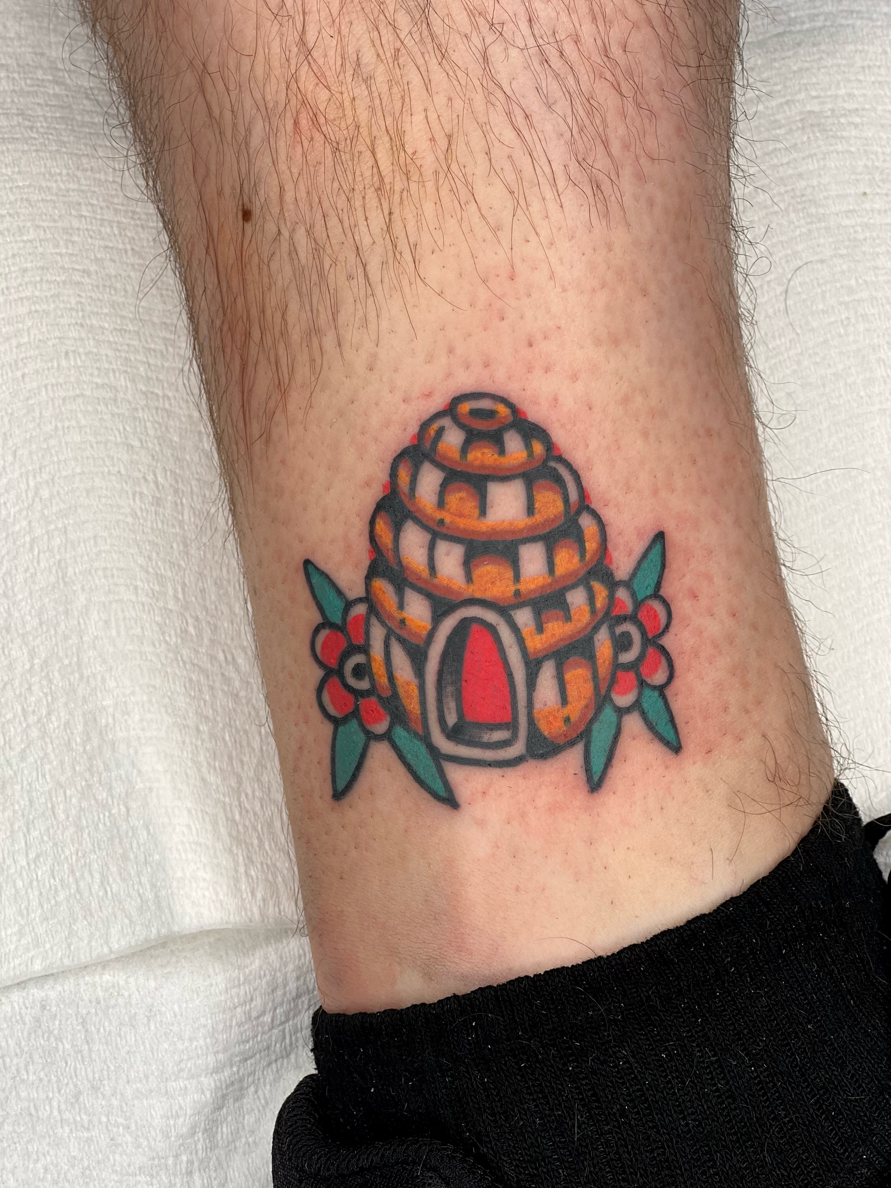 Beehive American traditional tattoo on the forearm by Christopher Durao