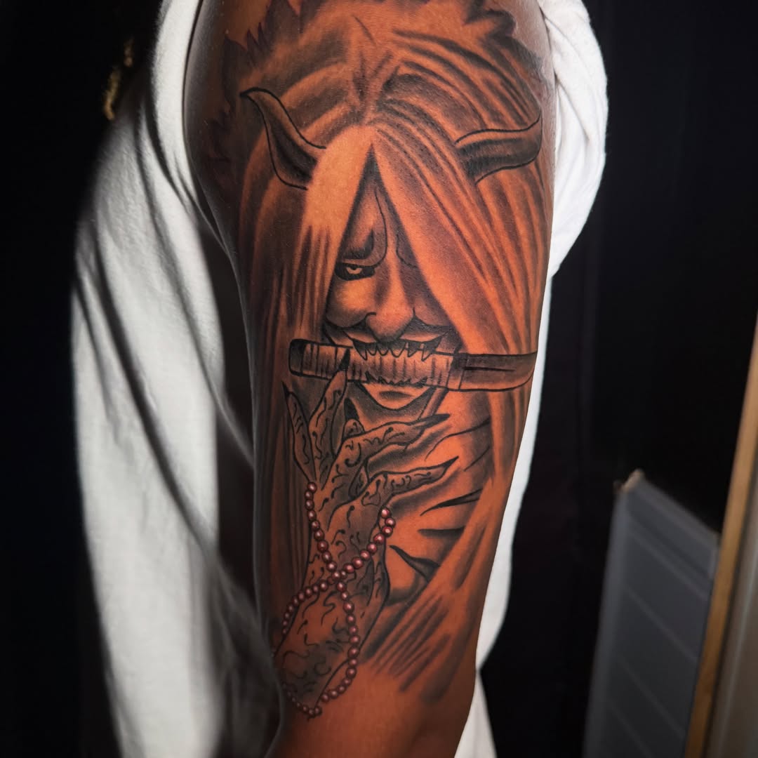 Demon face dark realism tattoo on the forearm by Anime Tattoo Columbus