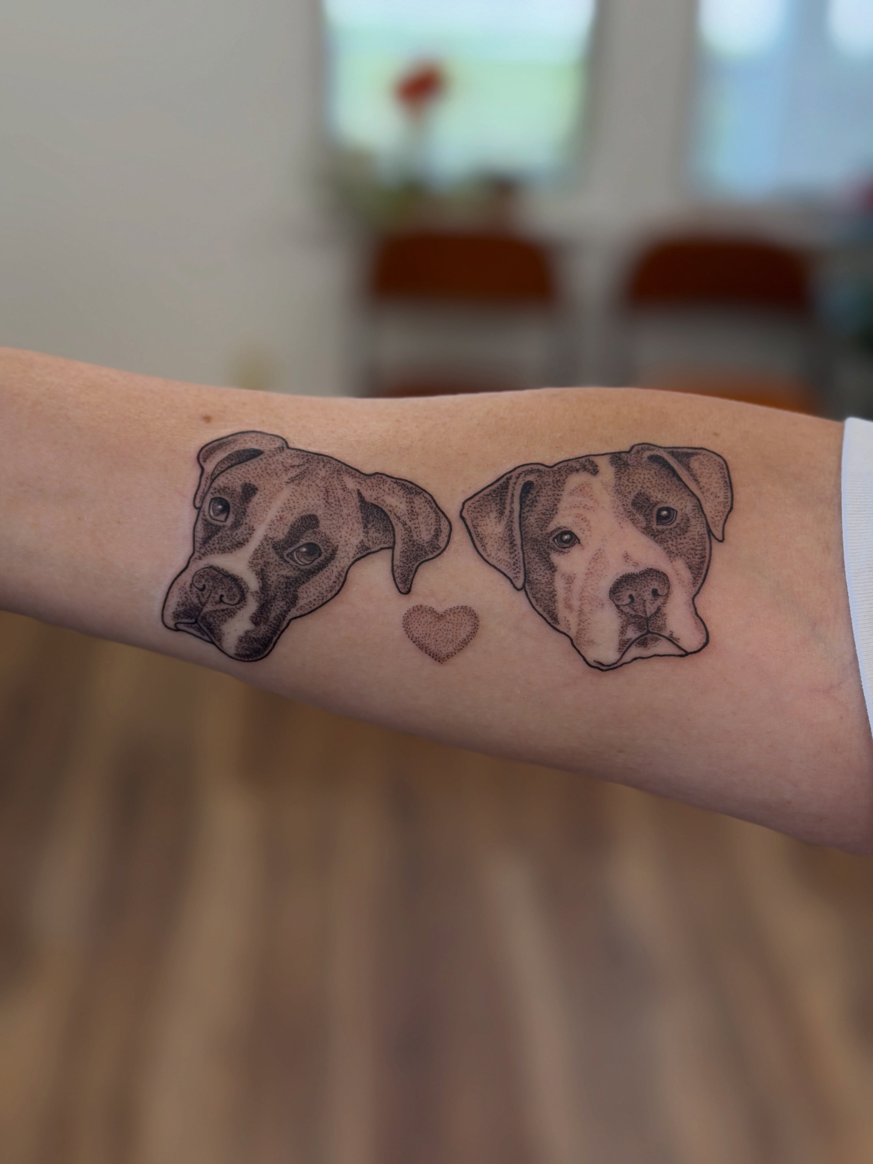 Dogs dotwork tattoo on the forearm by Alison (Wise) Best