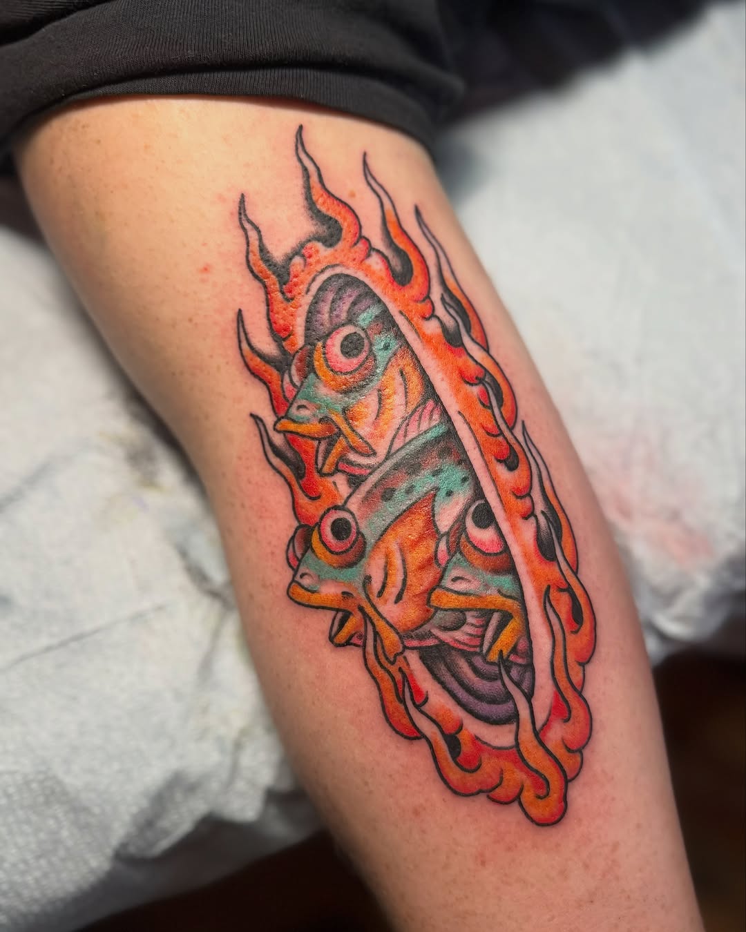 Fish American traditional tattoo on the thigh by B