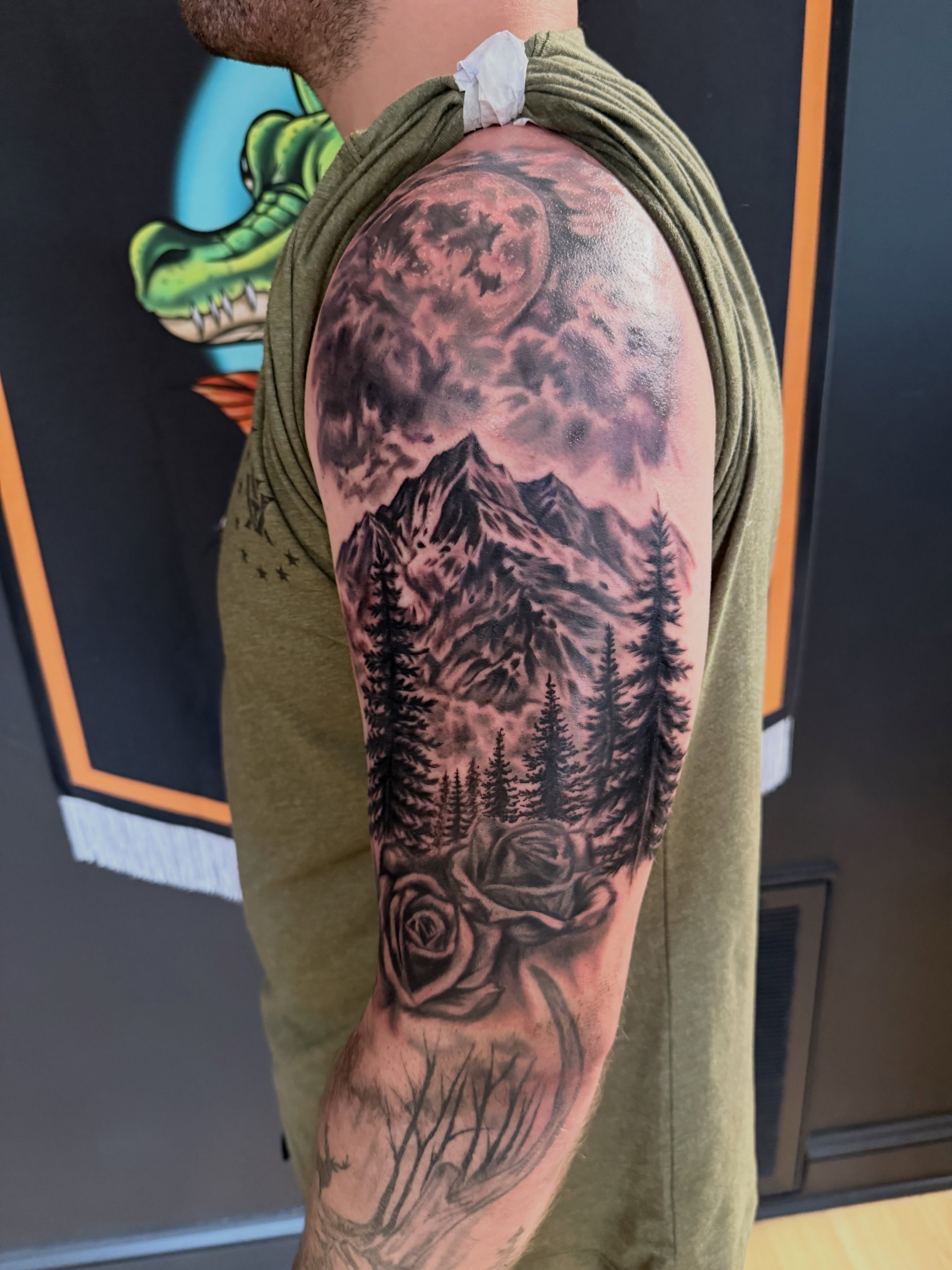 Mountain landscape realism tattoo on the shoulder by Tyler Bolton