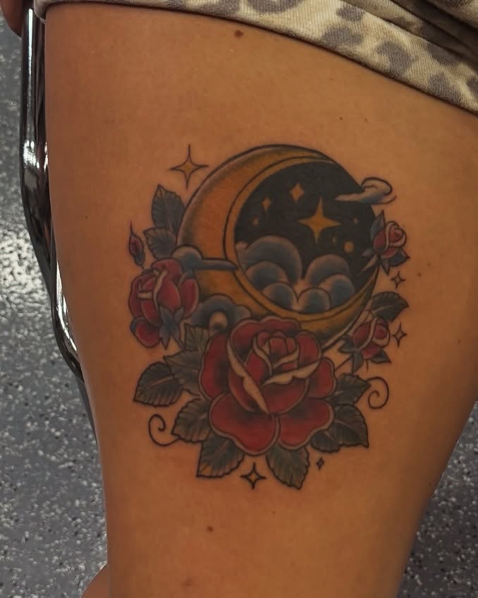 Moon and roses American traditional tattoo on the thigh by Uno Inks