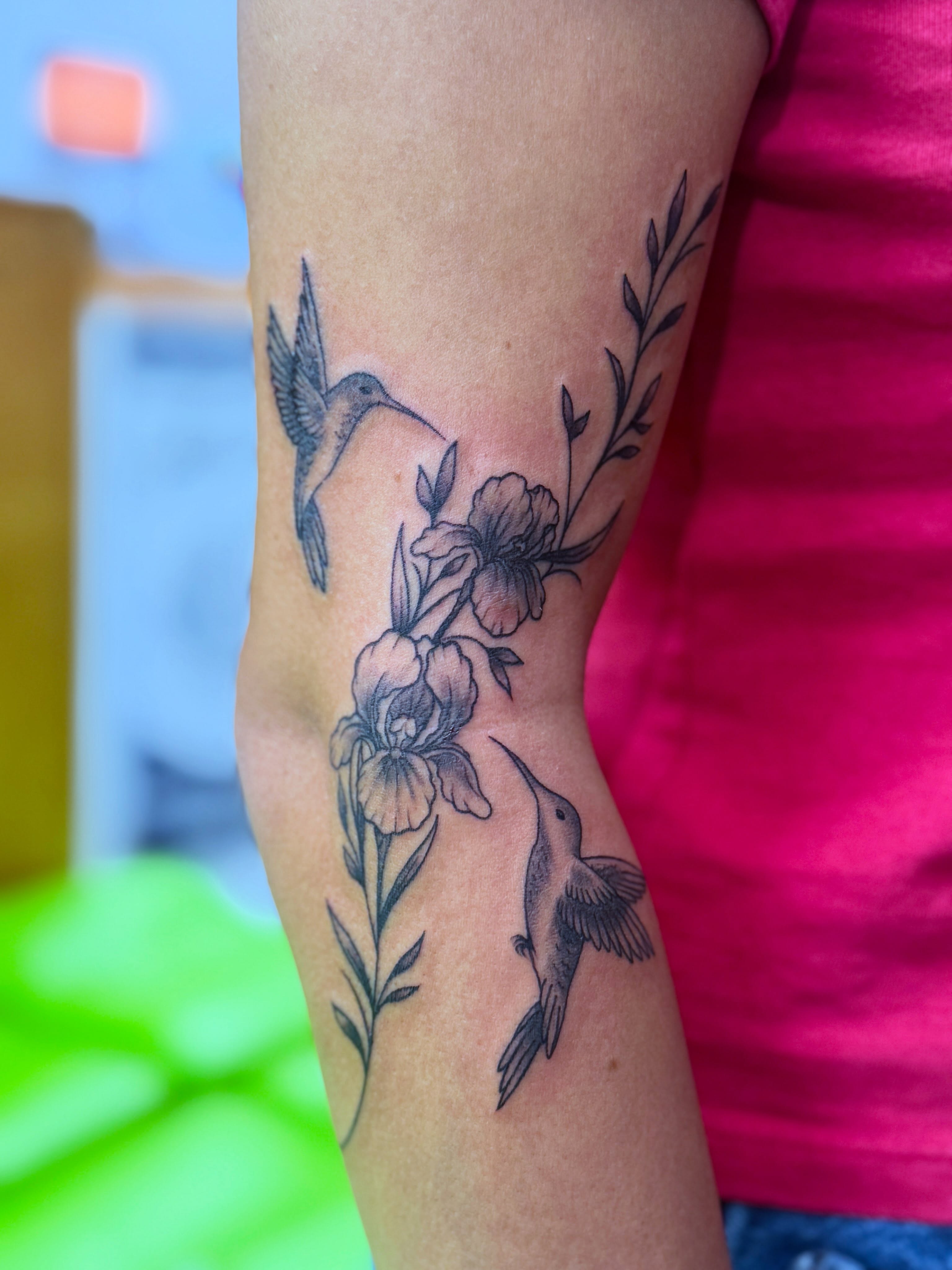 Hummingbirds and flowers realism tattoo on the forearm by Cristal Bidoul