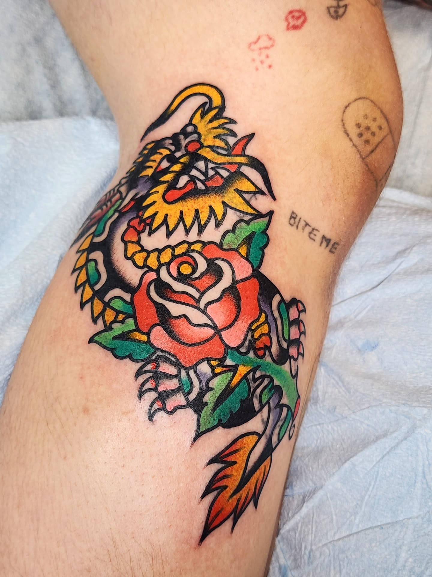 Dragon and rose American traditional tattoo on the thigh by πππππ