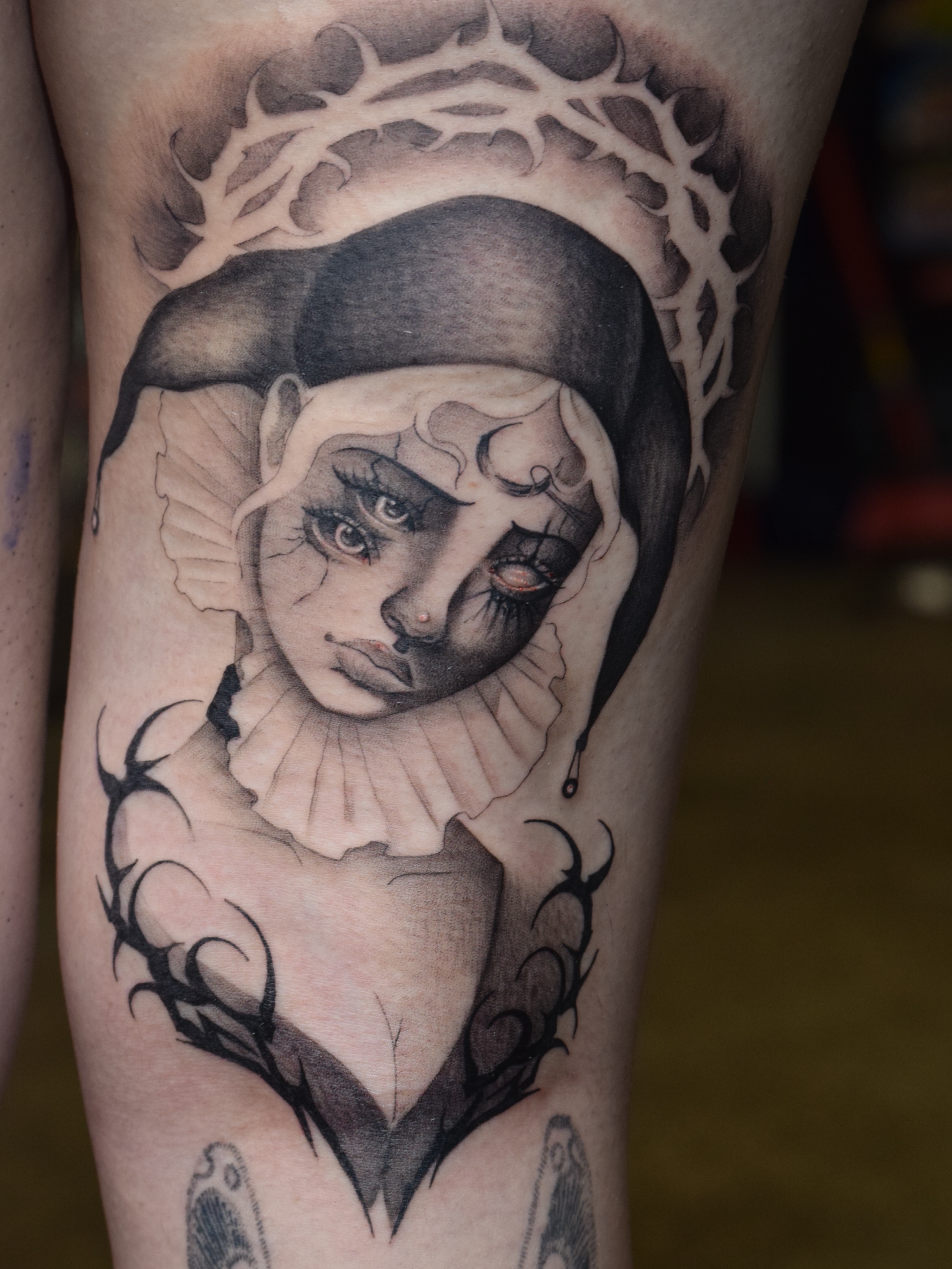 Clown realism tattoo on the forearm by @divineink_nyc