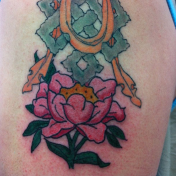 Peony and ornamental elements neo-traditional tattoo on the thigh by Kielin Green