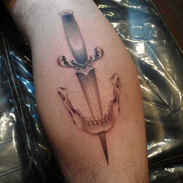 Knife and skull realism tattoo on the forearm by @jaclyngreb
