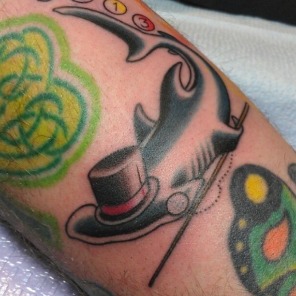Top hat and cane American traditional tattoo on the forearm by @jaclyngreb