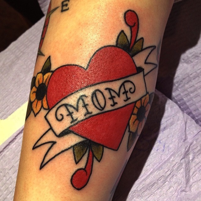 Heart with banner American traditional tattoo on the forearm by Derek Hutchison, Des Moines, Iowa