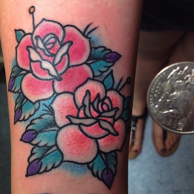 Roses American traditional tattoo on the forearm by Quality Tattoos done by Kurt