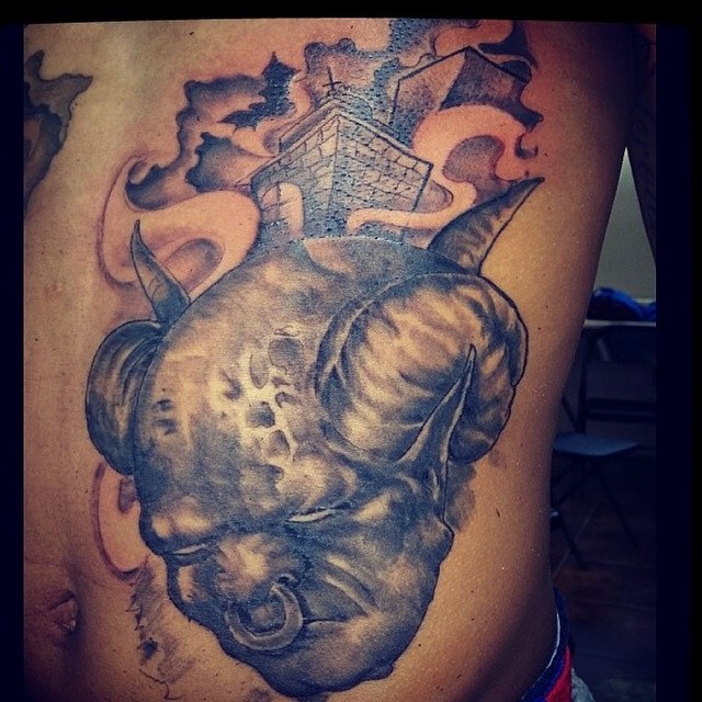 Rhino skull realism tattoo on the thigh by Sly Davis