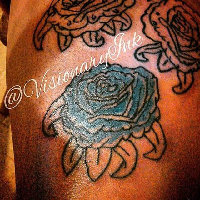 Blue rose black and grey tattoo on the shoulder by Visionary Ink