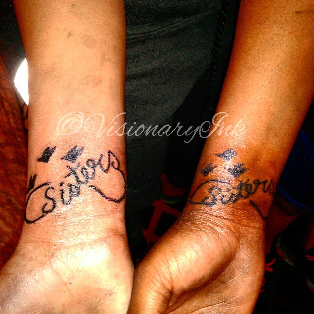 Sisters lettering script tattoo by Visionary Ink