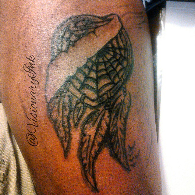 Bird black and grey tattoo on the thigh by Visionary Ink