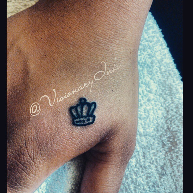 Crown tattoo on the forearm by Visionary Ink