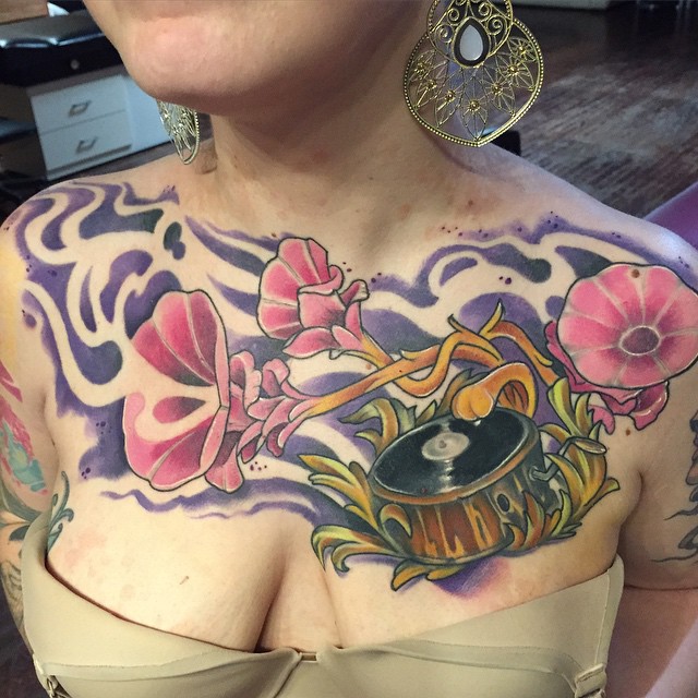 Flowers and record player new school tattoo on the chest by Derek Hutchison, Des Moines, Iowa